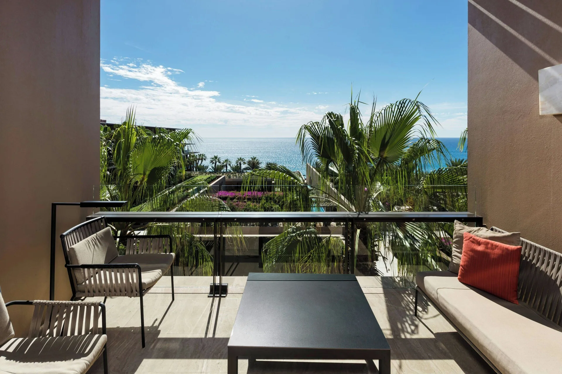 Ocean-view balcony with lounge seating at JW Marriott Los Cabos Beach Resort & Spa.