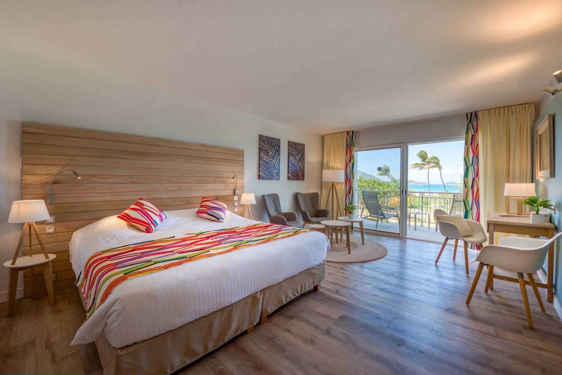 Junior Suite Kitchen Premium Garden king bed and balcony at La Playa Orient Bay.