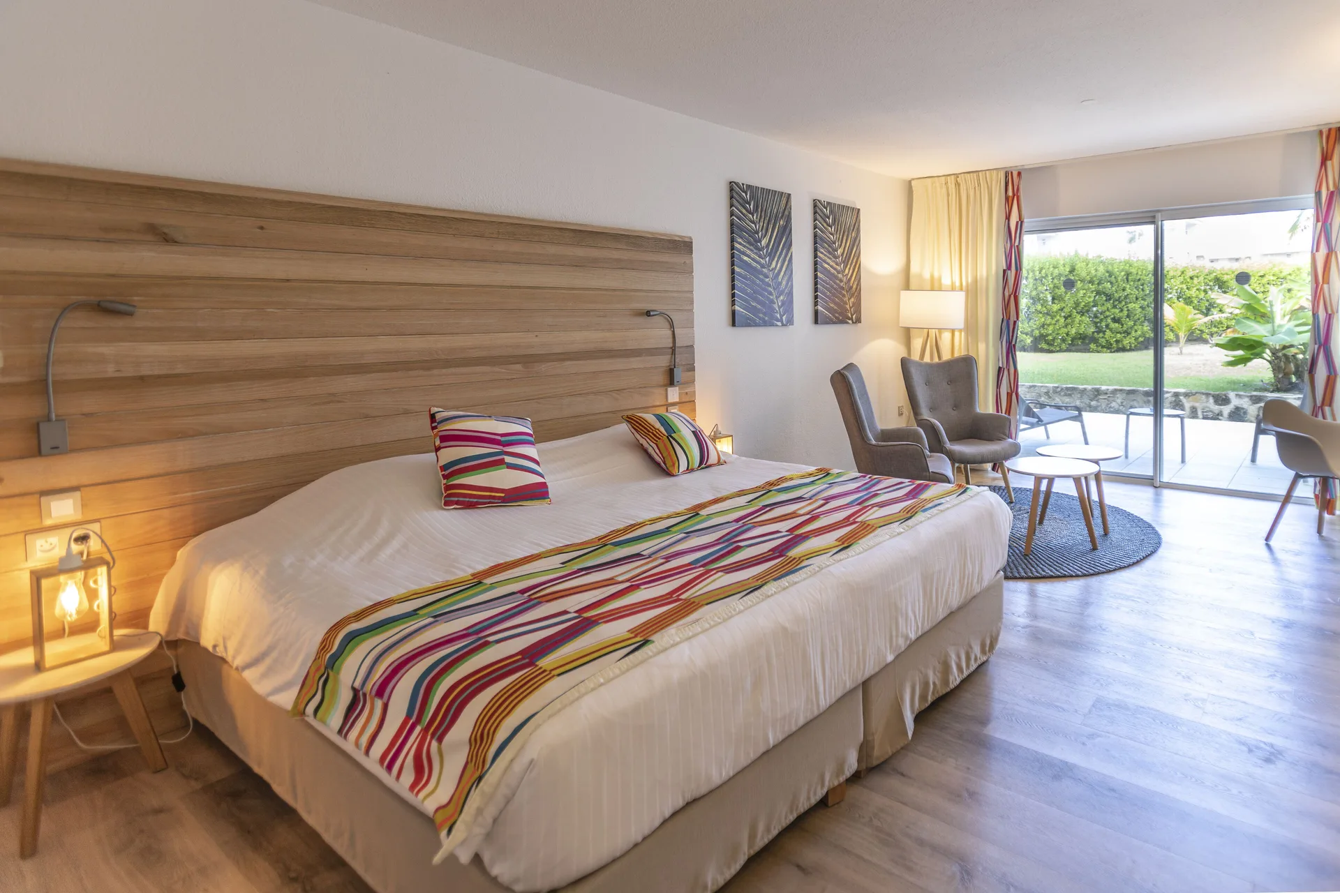Junior Suite Kitchen Premium Garden king bed and terrace doors at La Playa Orient Bay.