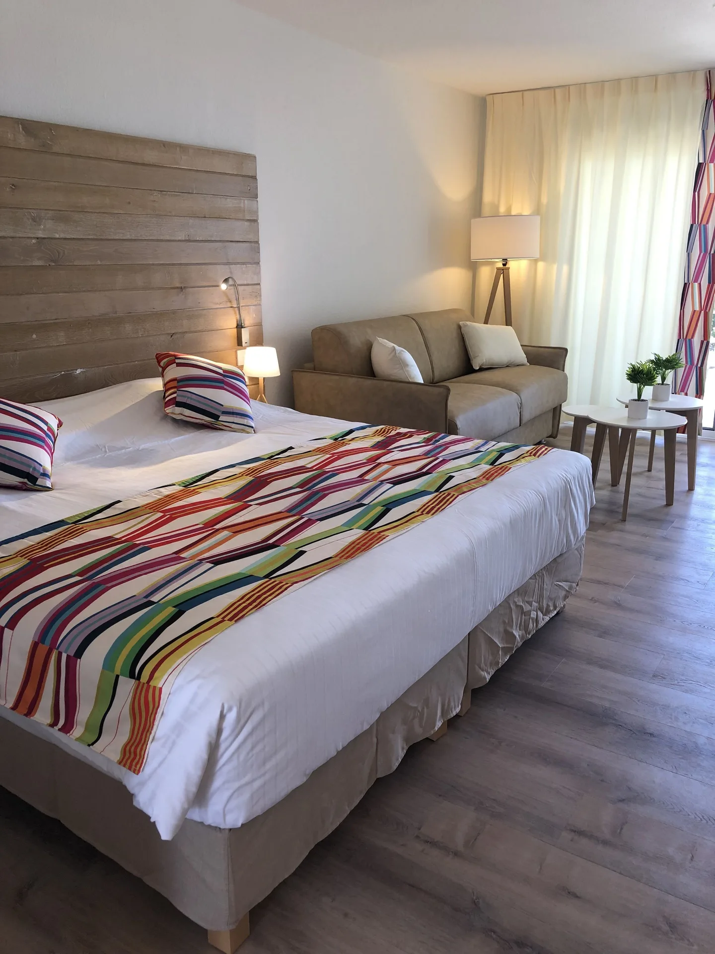 Junior Suite Kitchen Premium Ocean with bed and sofa at La Playa Orient Bay.