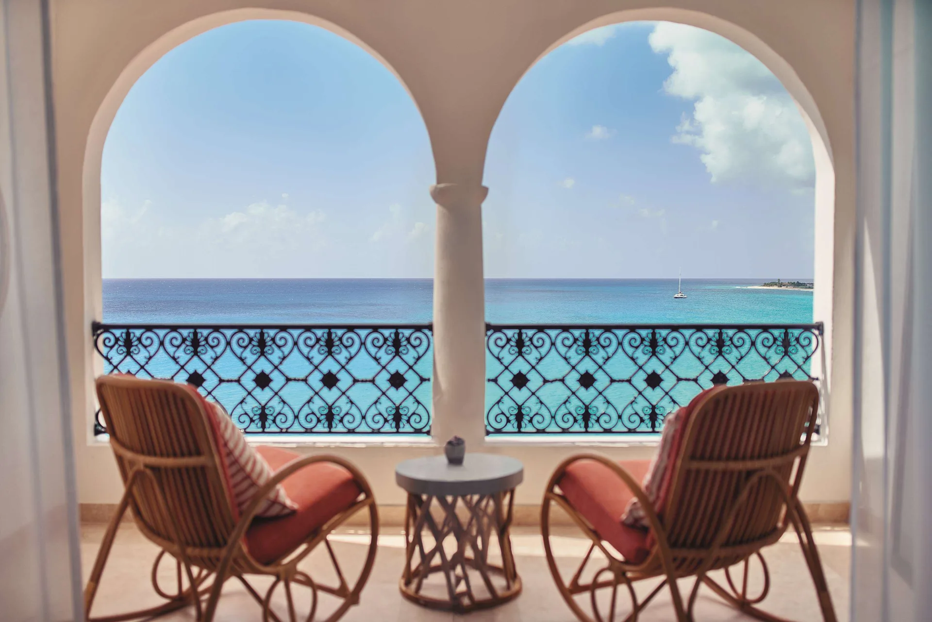 Deluxe Room Ocean View balcony with chairs facing the sea at La Samanna, St Martin.