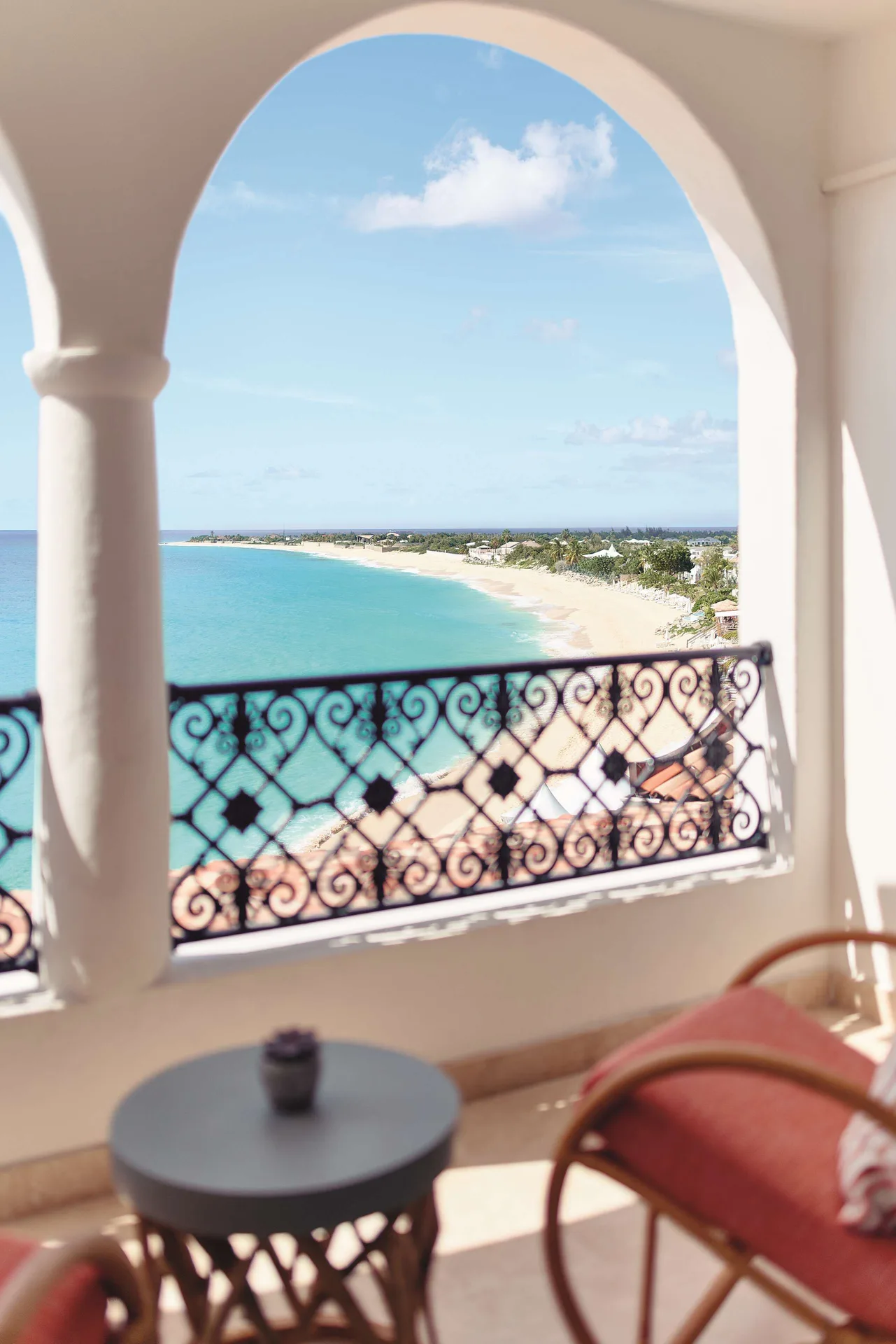 Deluxe Room Ocean View balcony overlooking the beach and bay at La Samanna, St Martin.
