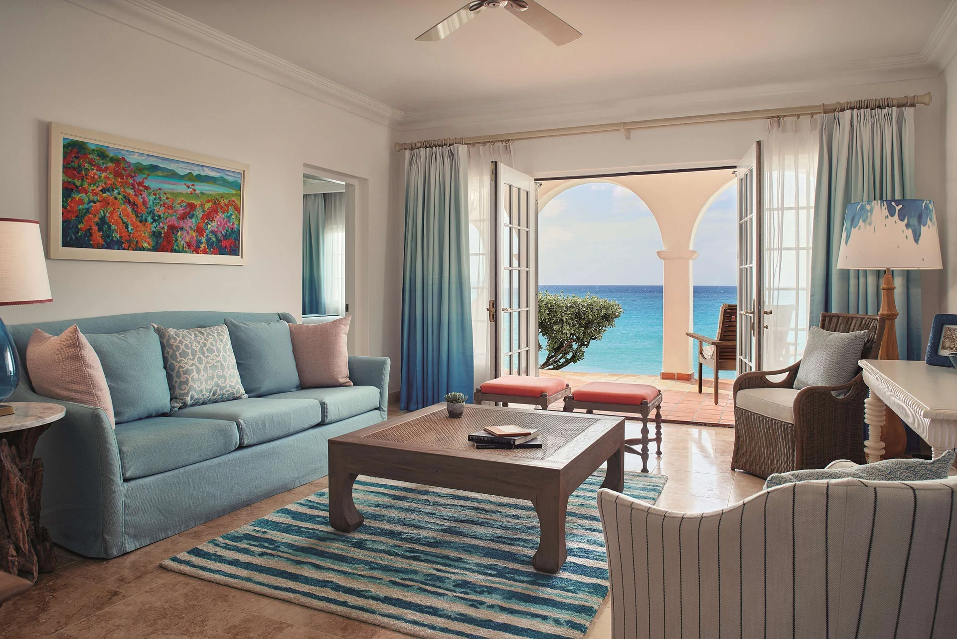 Beachfront one-bedroom suite living room with terrace and sea view at La Samanna, St Martin