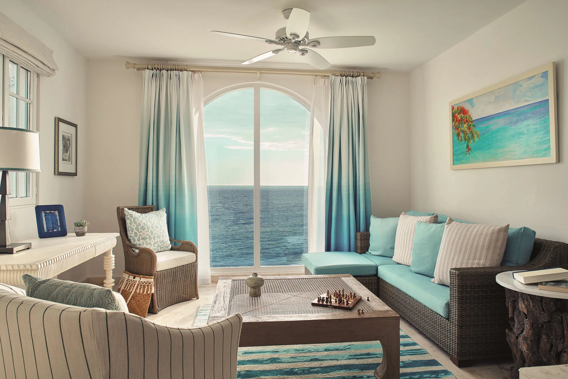 Ocean-view living room in a one-bedroom terrace suite at La Samanna, St Martin.