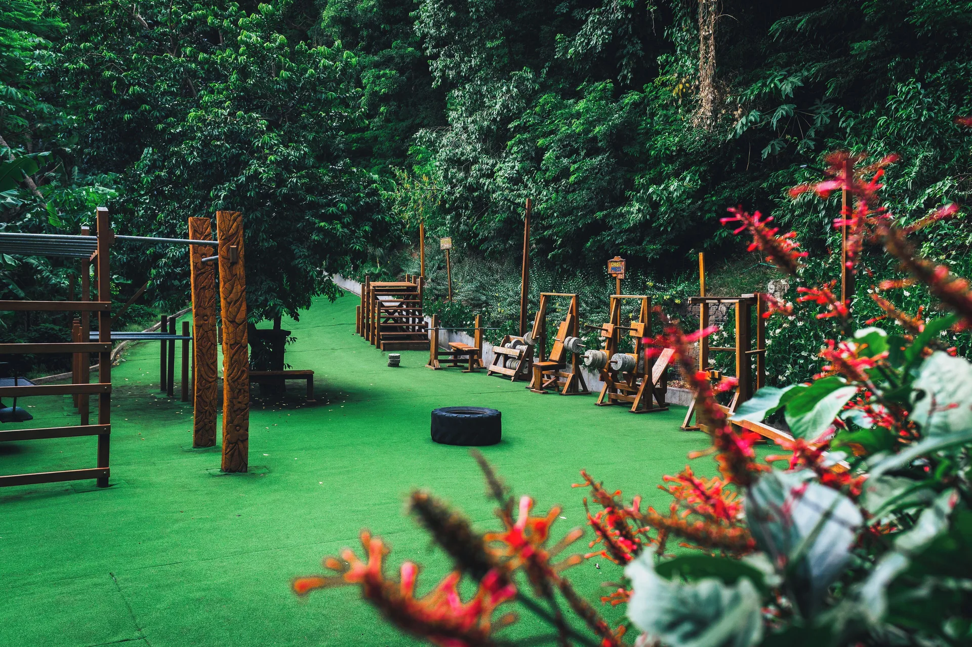 Outdoor fitness area with exercise equipment in tropical forest at Ladera Resort.