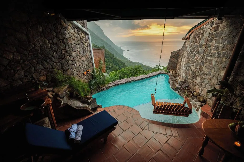 Hilltop Dream Suite plunge pool with a swing seat and coastal sunset view at Ladera Resort.