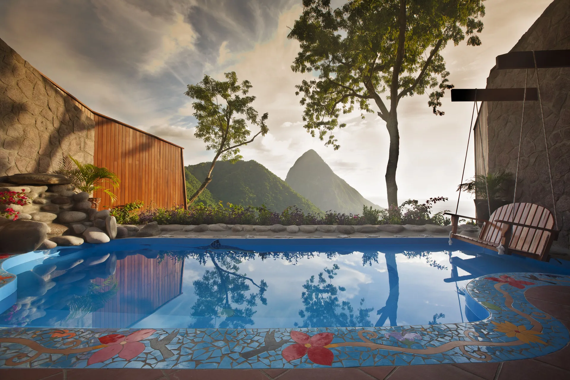 Private plunge pool at Ladera Resort with Piton mountain views and colorful mosaic tile.