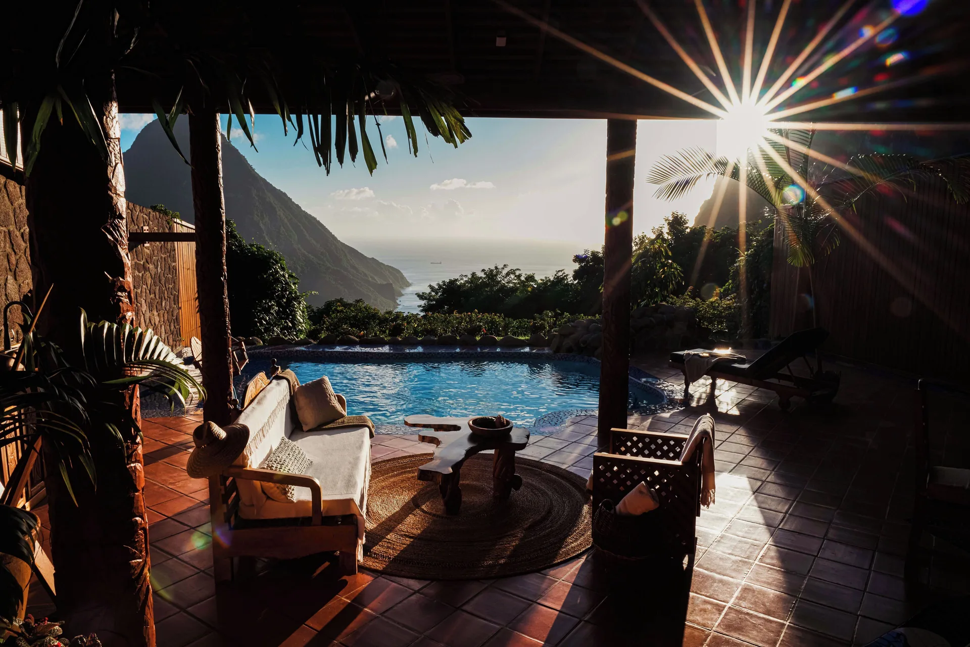 Open-air suite terrace at Ladera Resort with seating, plunge pool, and ocean-facing Piton view.