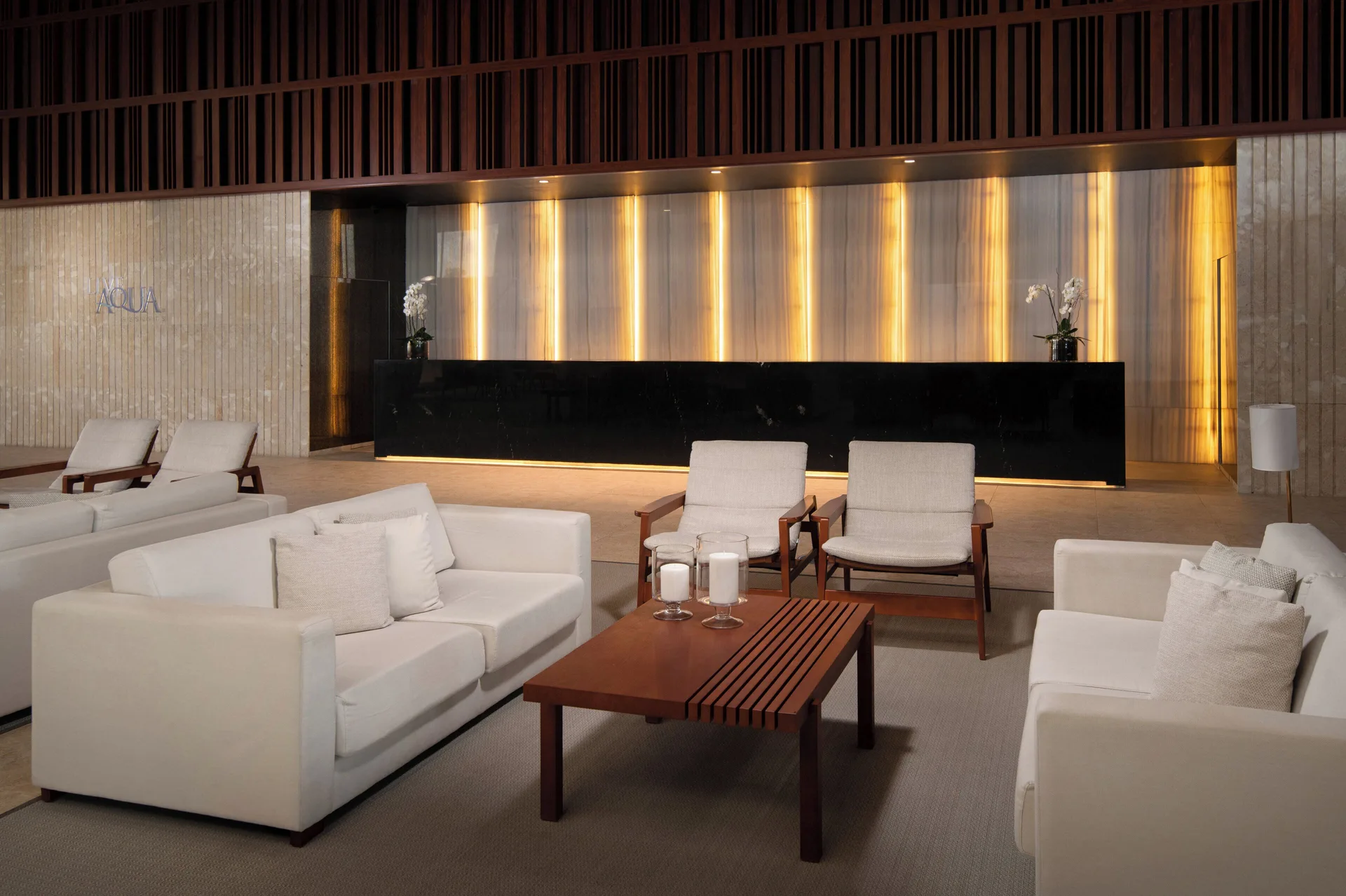 Lobby lounge seating facing the reception desk at Live Aqua Punta Cana.