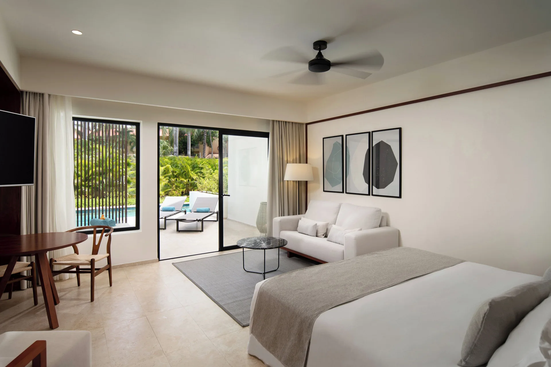 Aqua Junior Suite king bed and sitting area at Live Aqua Punta Cana.