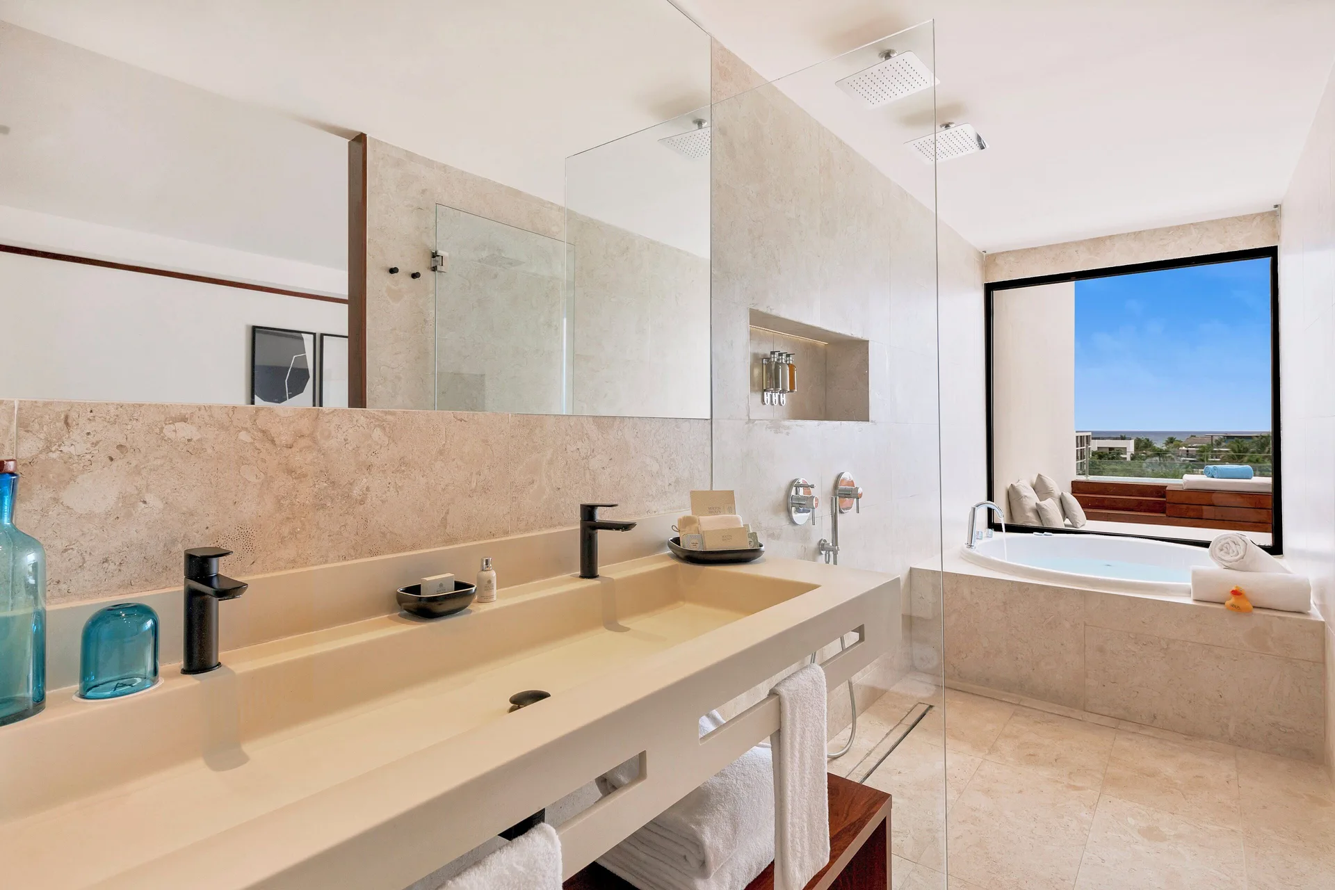 Fuego Suite Partial Ocean View bathroom with tub and double vanity at Live Aqua Punta Cana.