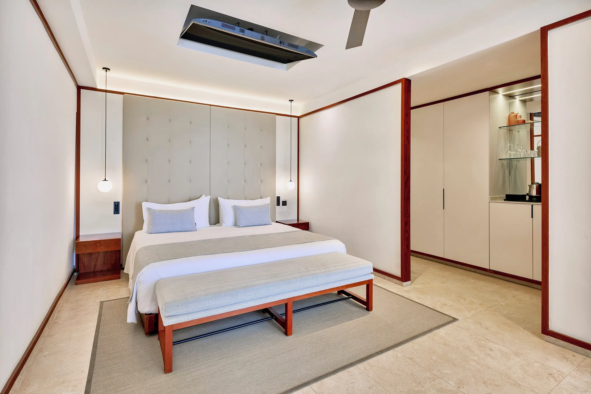 Fuego Suite Partial Ocean View king bed with minibar area at Live Aqua Punta Cana.