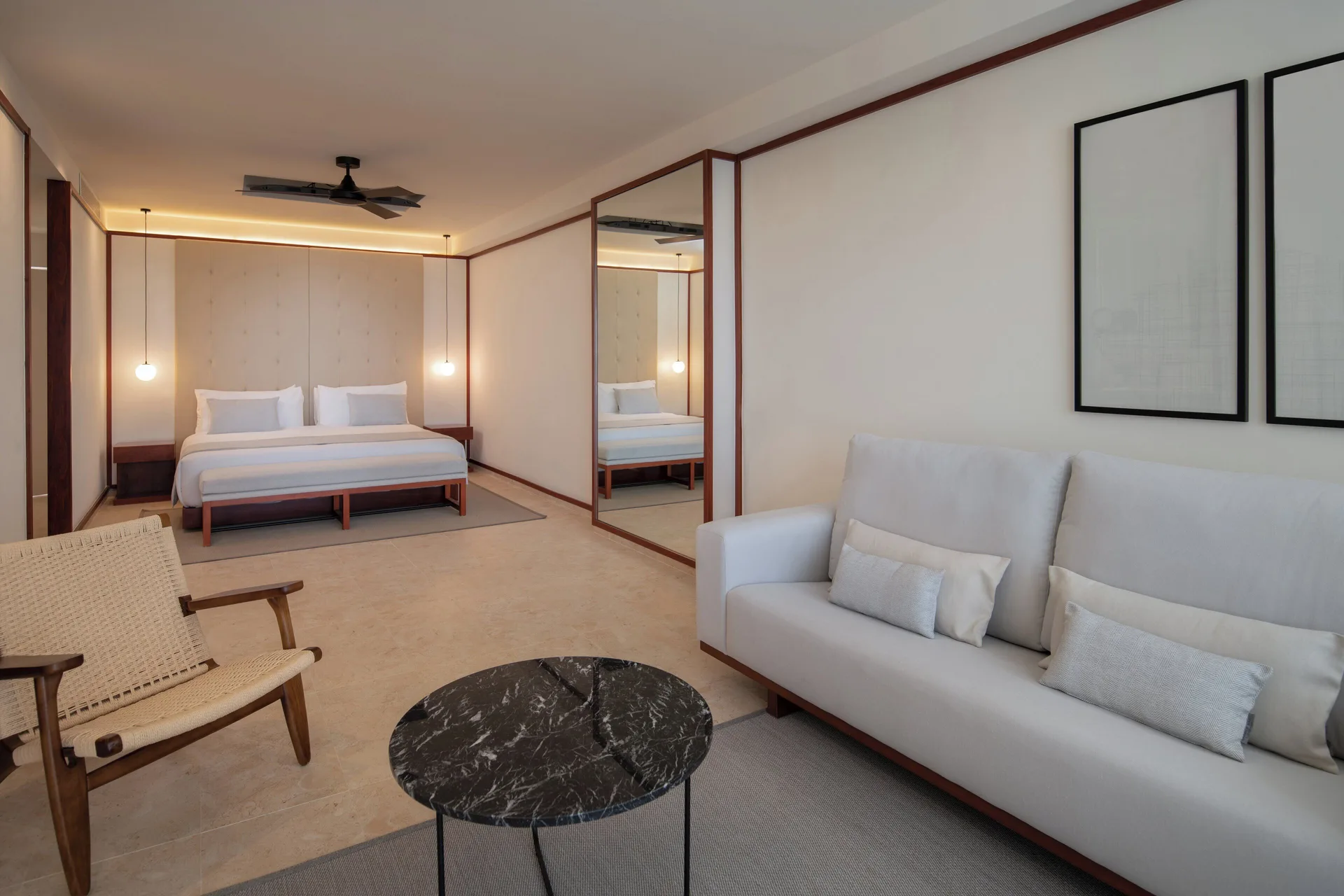 Fuego Suite Partial Ocean View seating and king bed at Live Aqua Punta Cana.