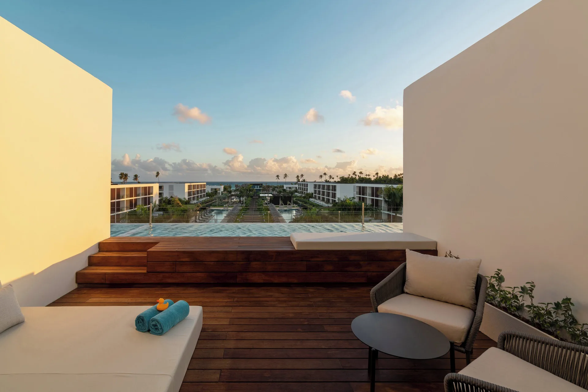 Fuego Suite Partial Ocean View terrace seating at sunset at Live Aqua Punta Cana.