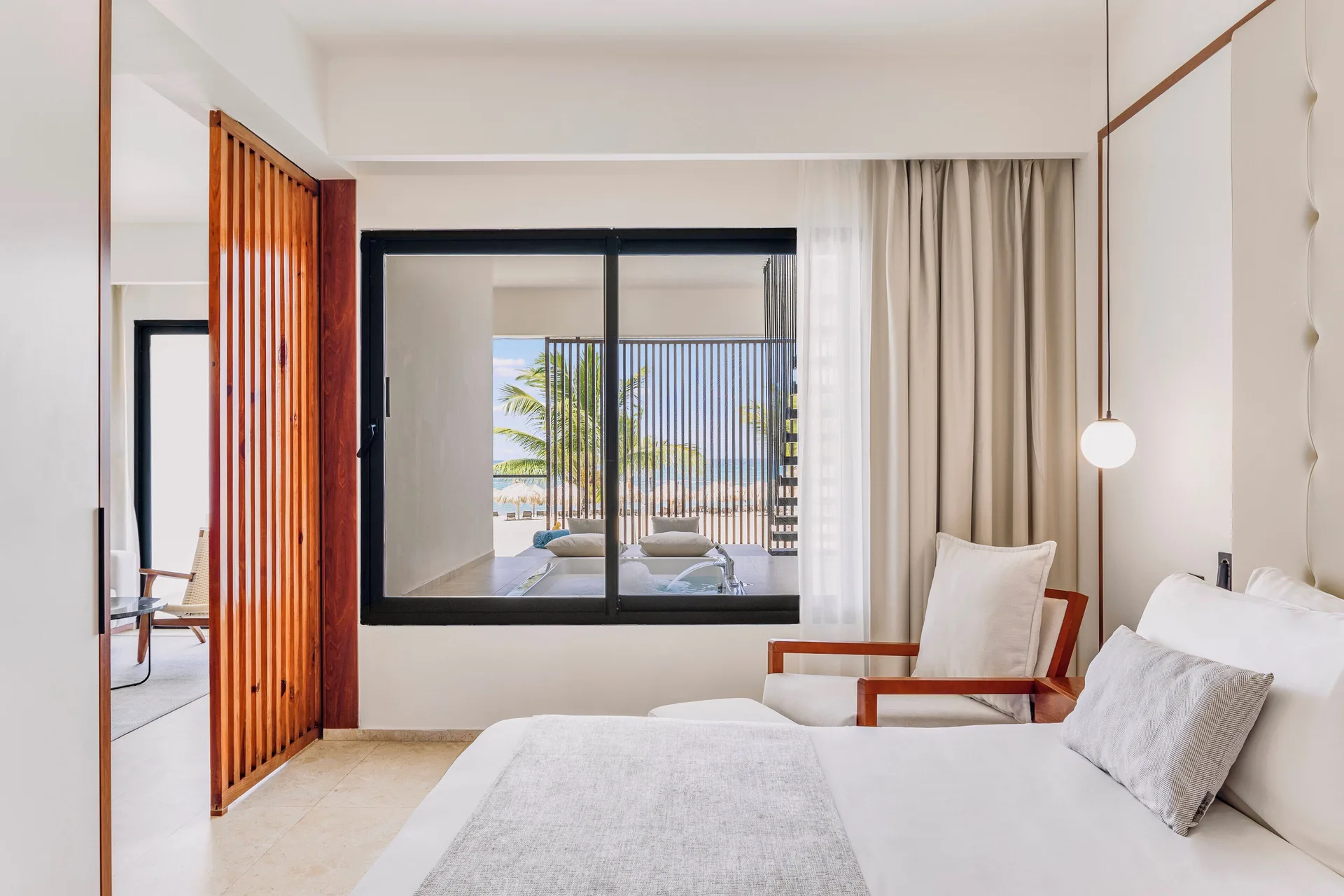 Viento Suite Ocean Front bedroom with terrace view at Live Aqua Punta Cana.