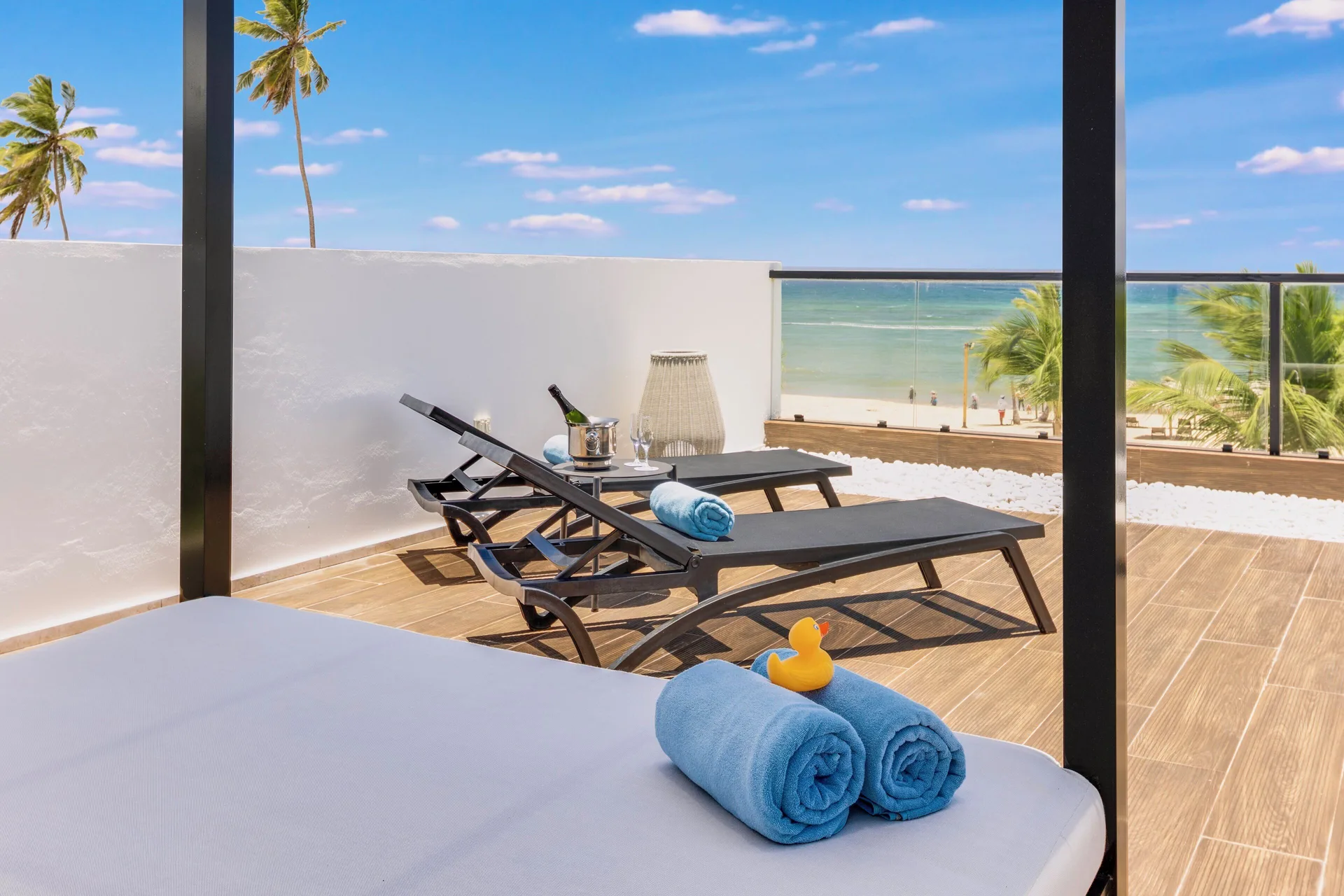 Viento Suite Ocean Front terrace daybed and loungers at Live Aqua Punta Cana.