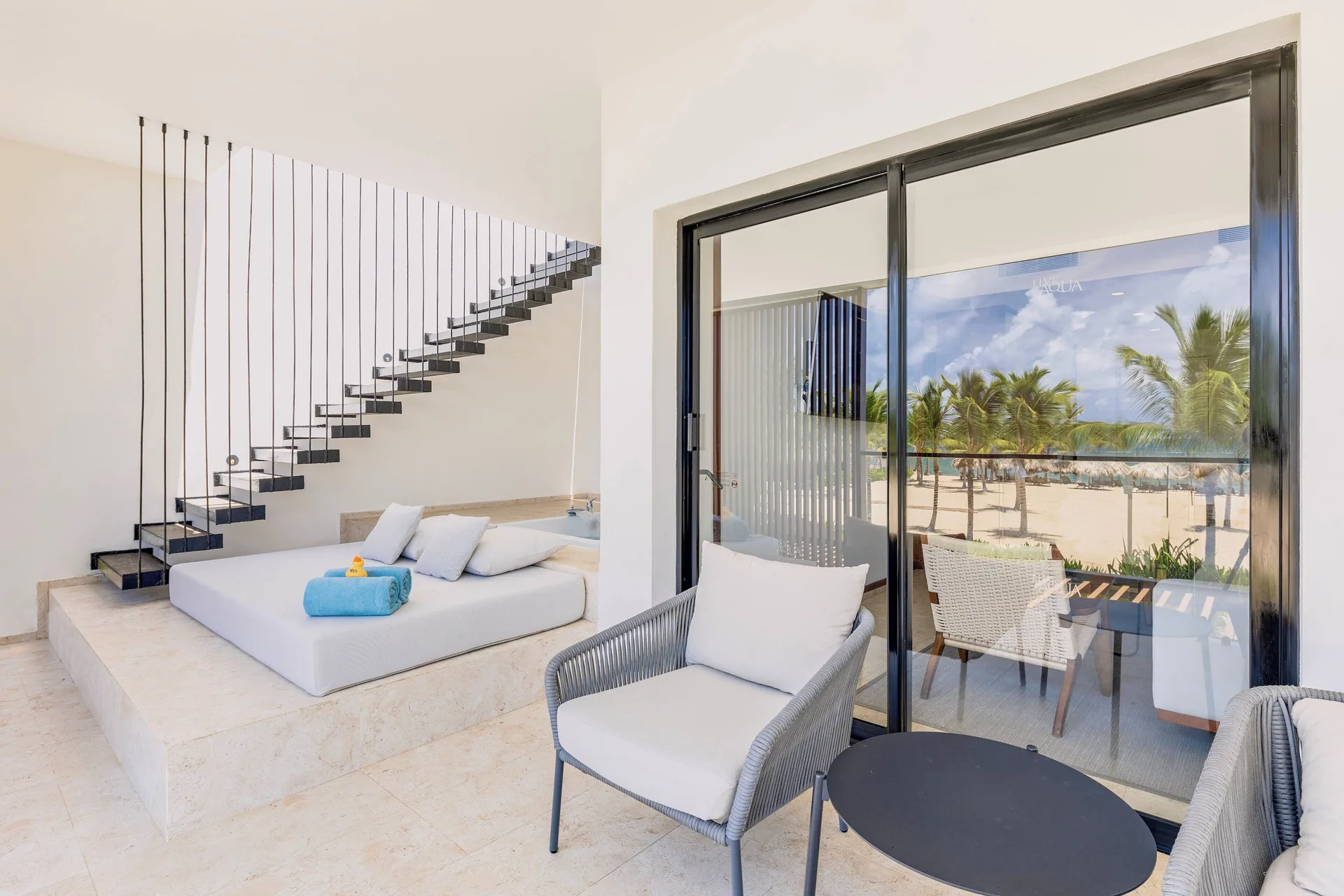 Viento Suite Ocean Front terrace lounge and stairs at Live Aqua Punta Cana.