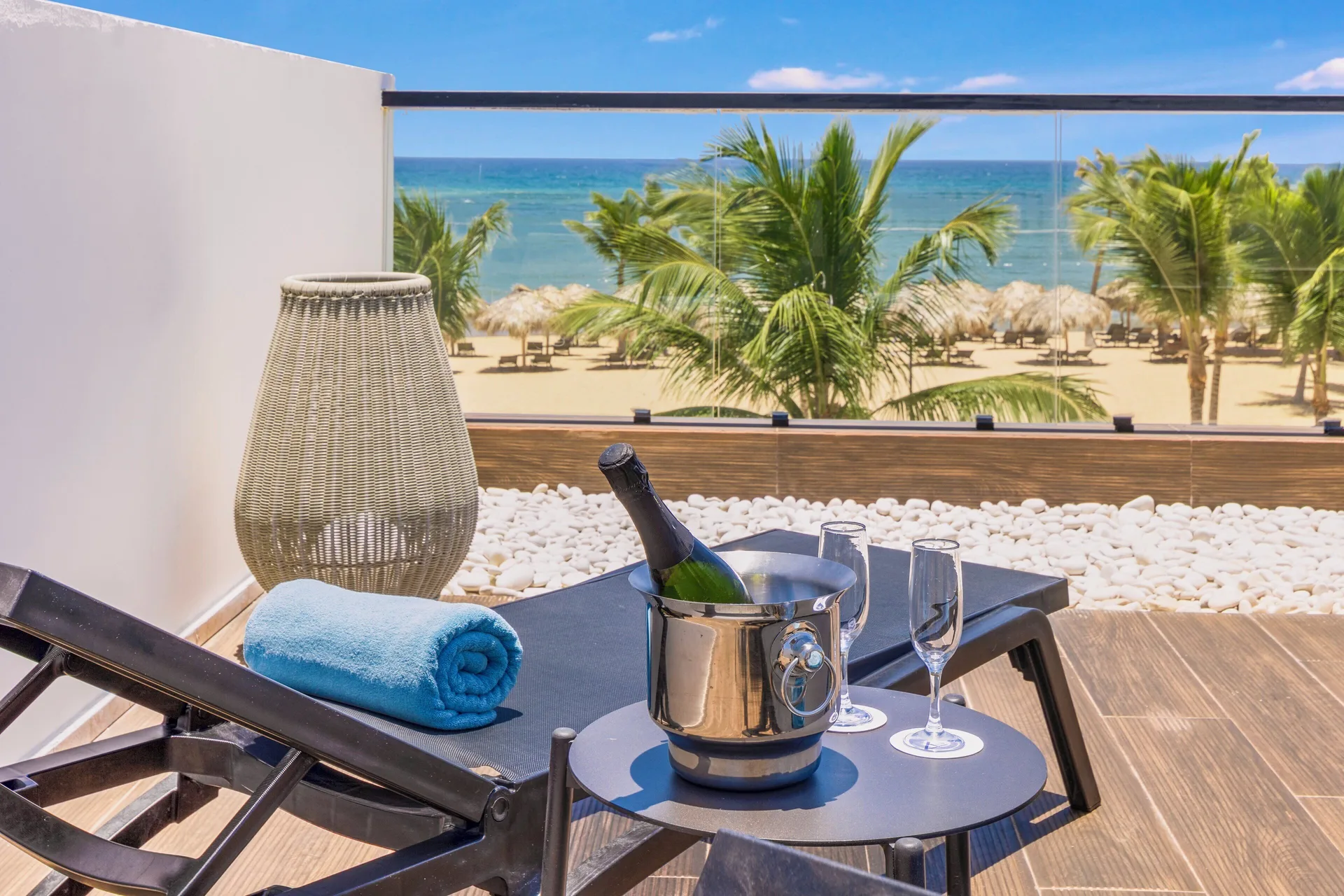 Viento Suite Ocean Front terrace loungers and sea view at Live Aqua Punta Cana.