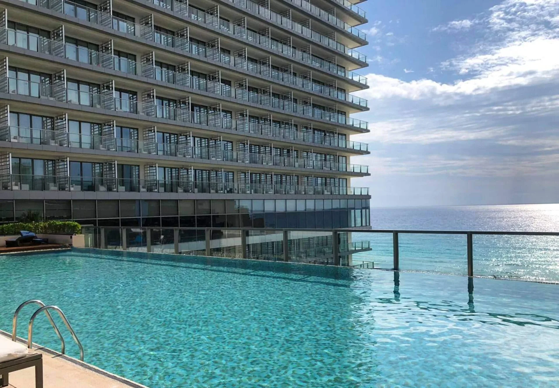 Secrets The Vine Cancun adults-only all-inclusive resort with modern architecture, beachfront pools, and Hotel Zone location.