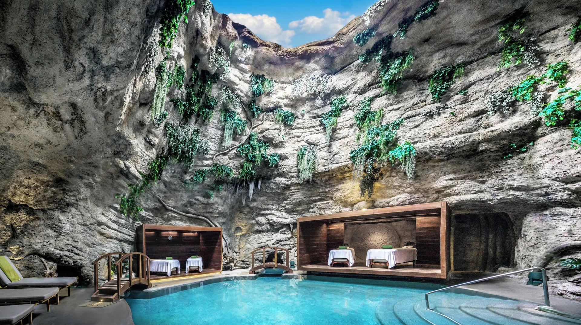 Cave-style spa pool with treatment beds at Majestic Elegance Costa Mujeres.
