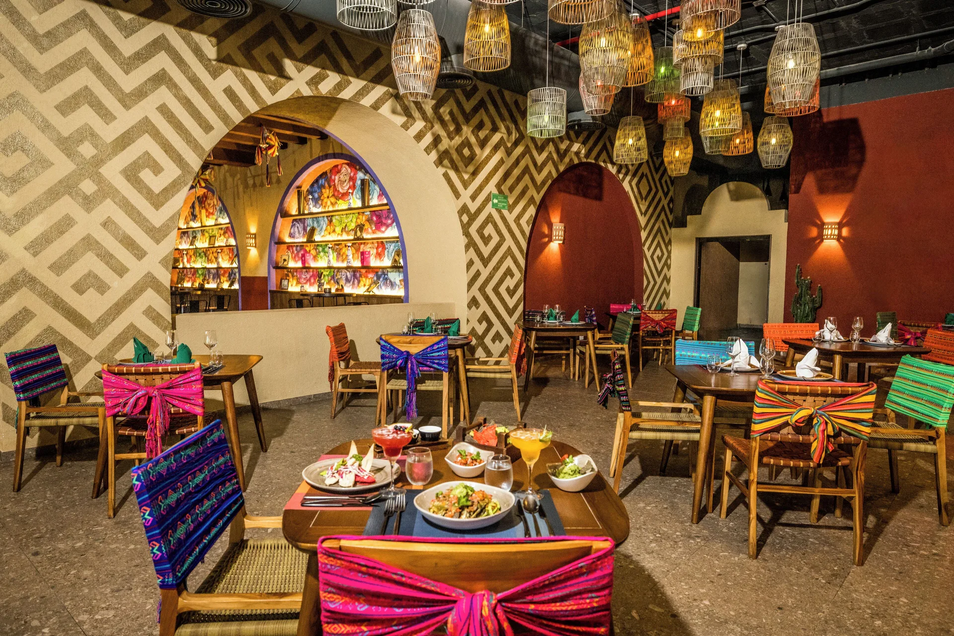 Colorful Mexican-style restaurant dining room at Majestic Elegance Costa Mujeres.