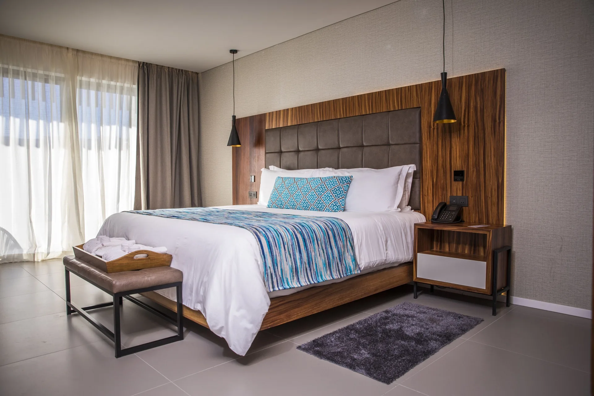 Elegance Club One Bedroom Suite king bed at Majestic Elegance Costa Mujeres with balcony curtains.
