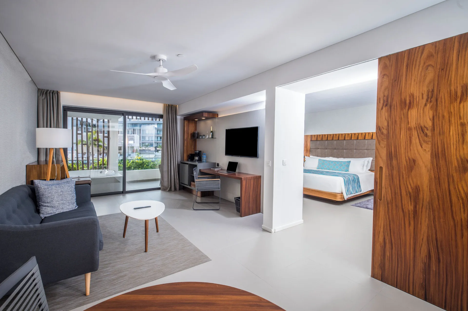 Elegance Club One Bedroom Suite living room and king bedroom at Majestic Elegance Costa Mujeres.