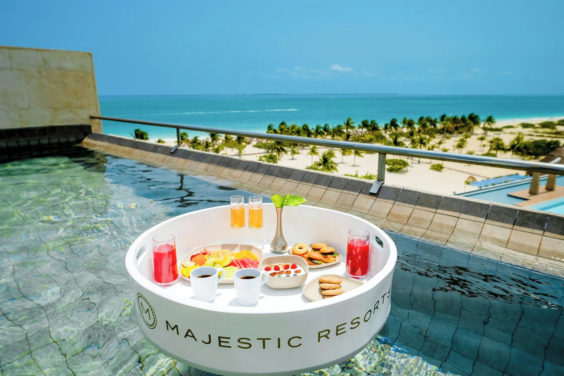 Floating breakfast in the plunge pool at Majestic Elegance Costa Mujeres.
