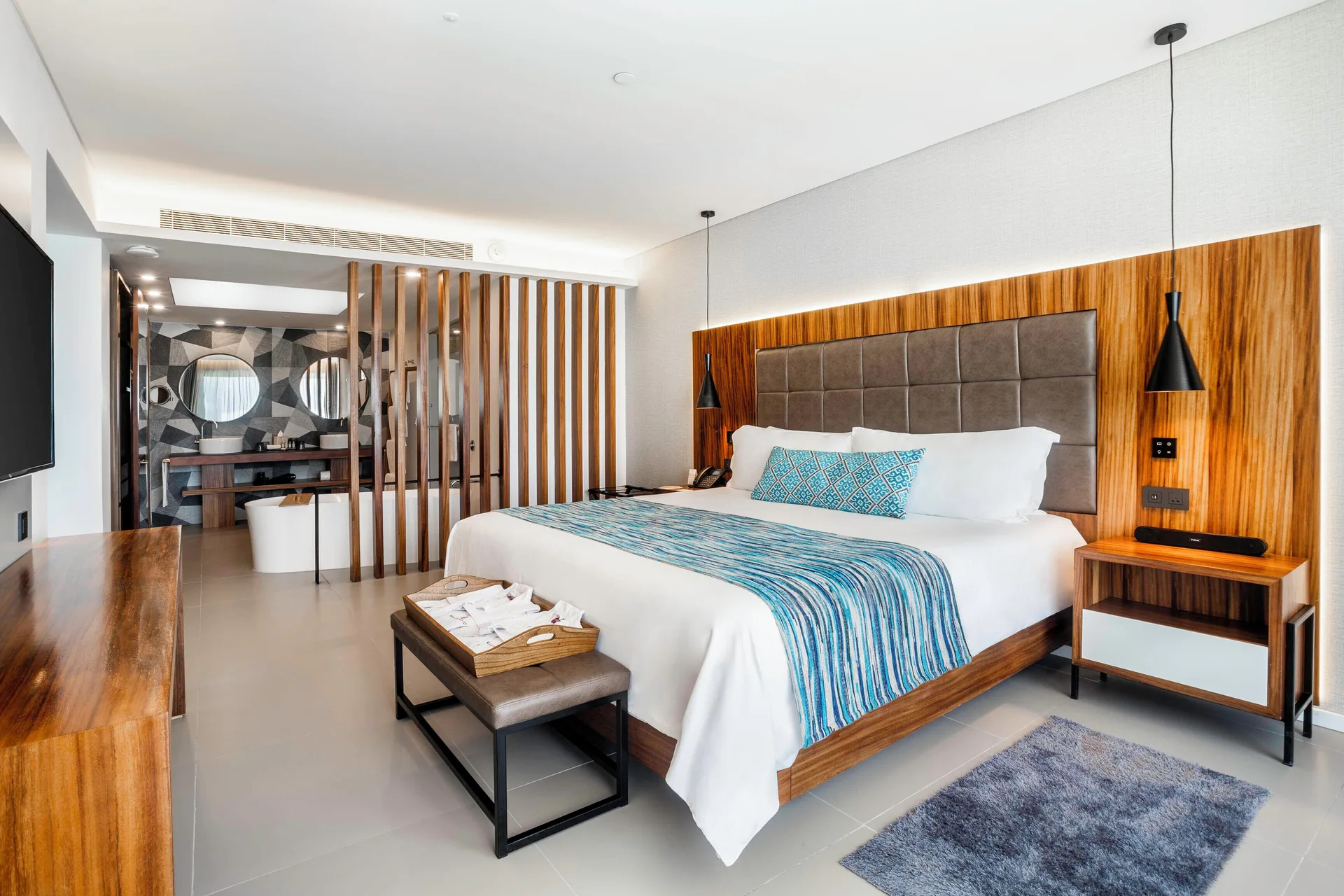 One Bedroom Suite with king bed and open bathroom at Majestic Elegance Costa Mujeres.