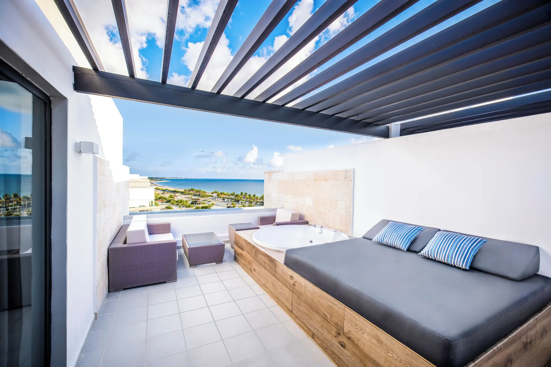 Sky View Suite rooftop terrace with outdoor Jacuzzi at Majestic Elegance Costa Mujeres.