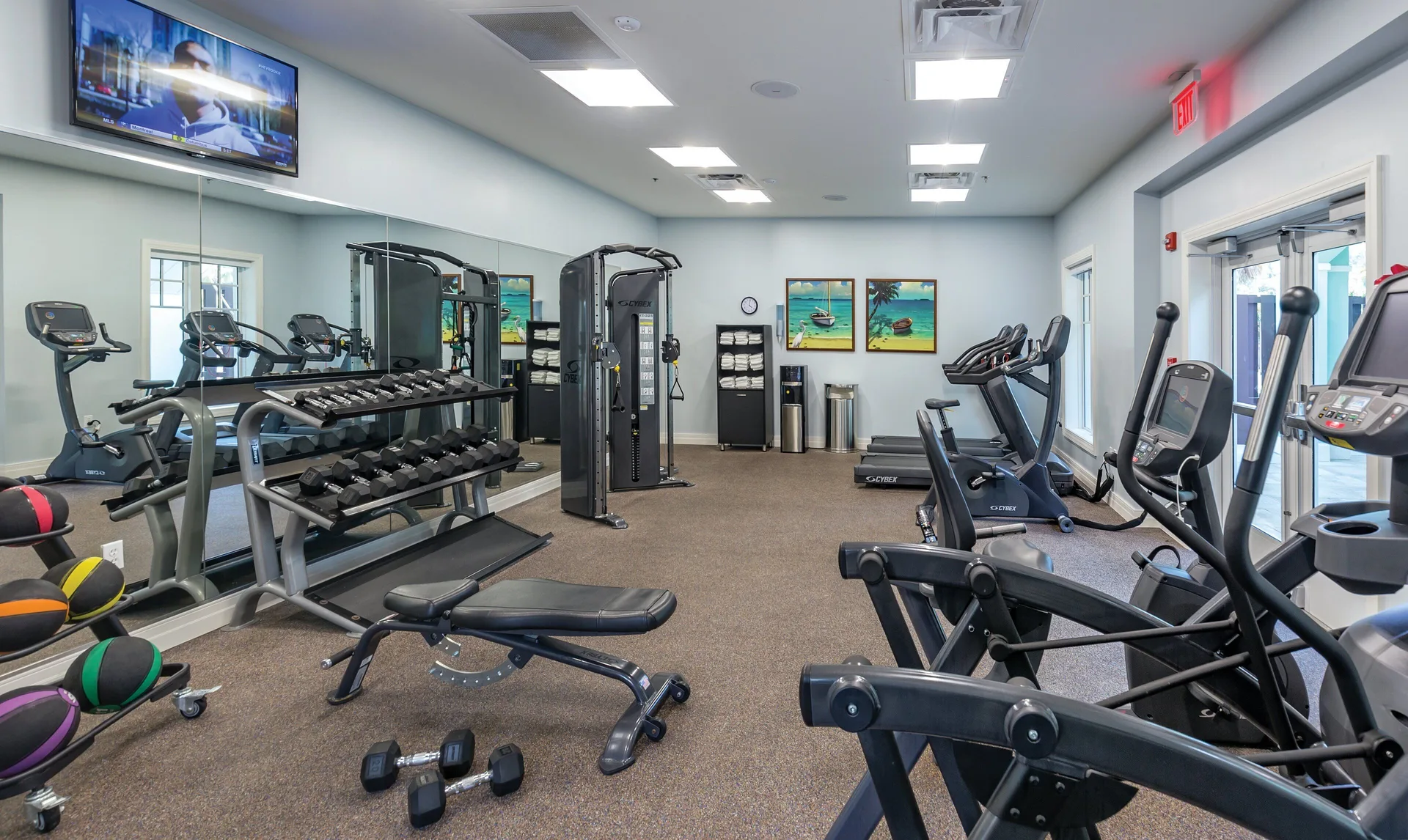 Fitness center with cardio machines and weights at Margaritaville Vacation Club - St. Thomas.