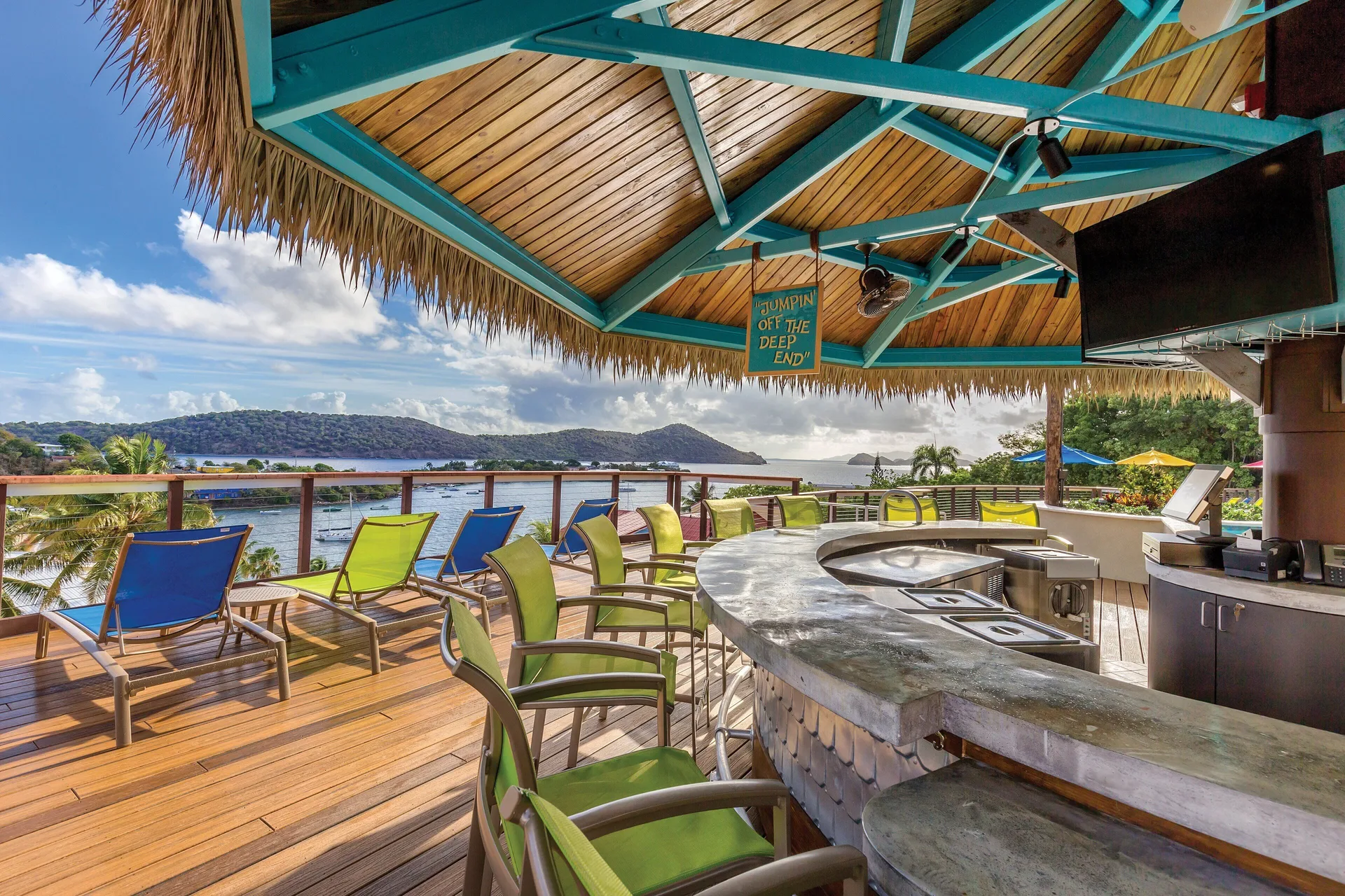 Open-air poolside bar with ocean views at Margaritaville Vacation Club - St. Thomas.