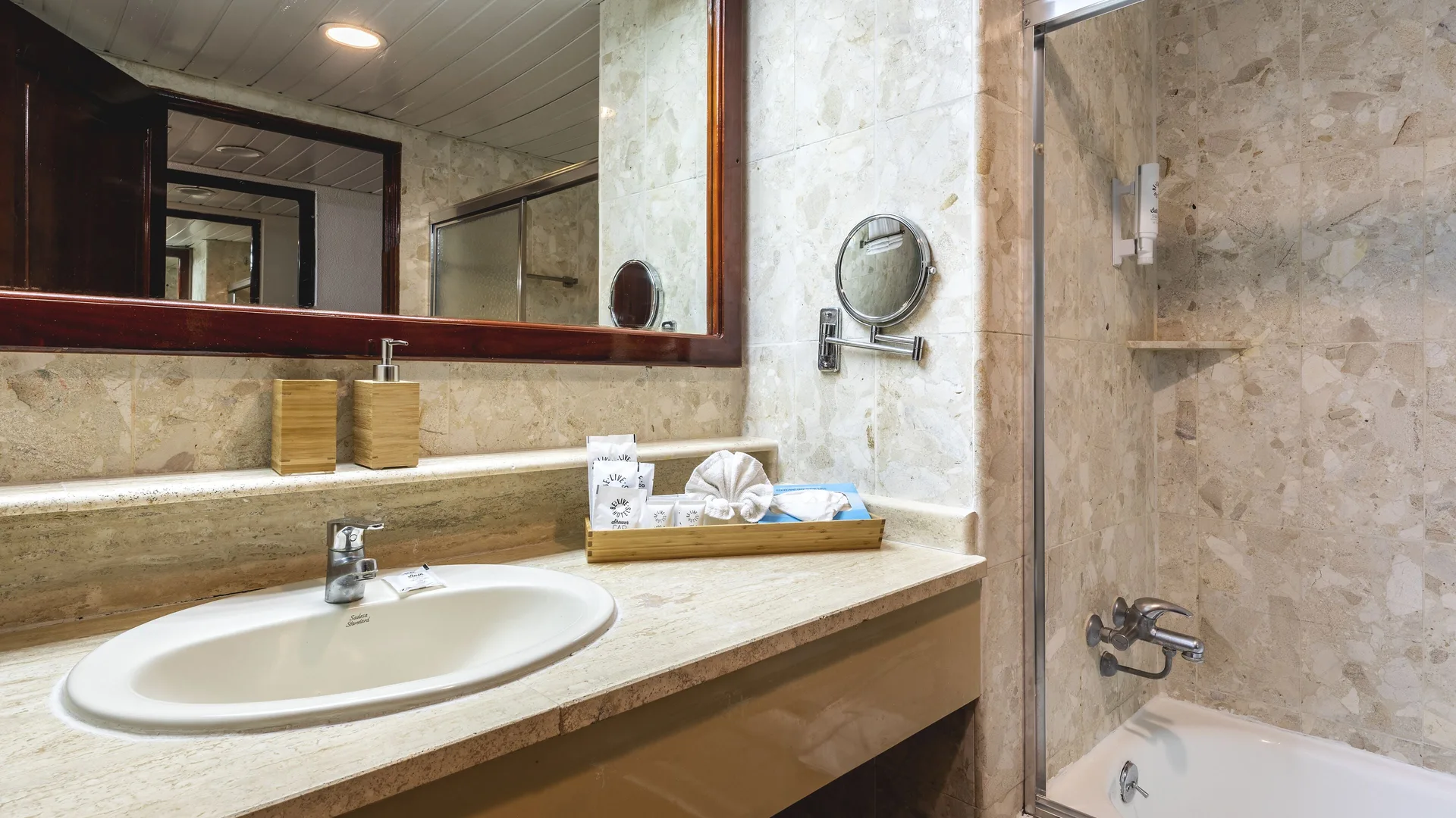 Deluxe Room Garden View bathroom sink and tub shower at Marien Puerto Plata.