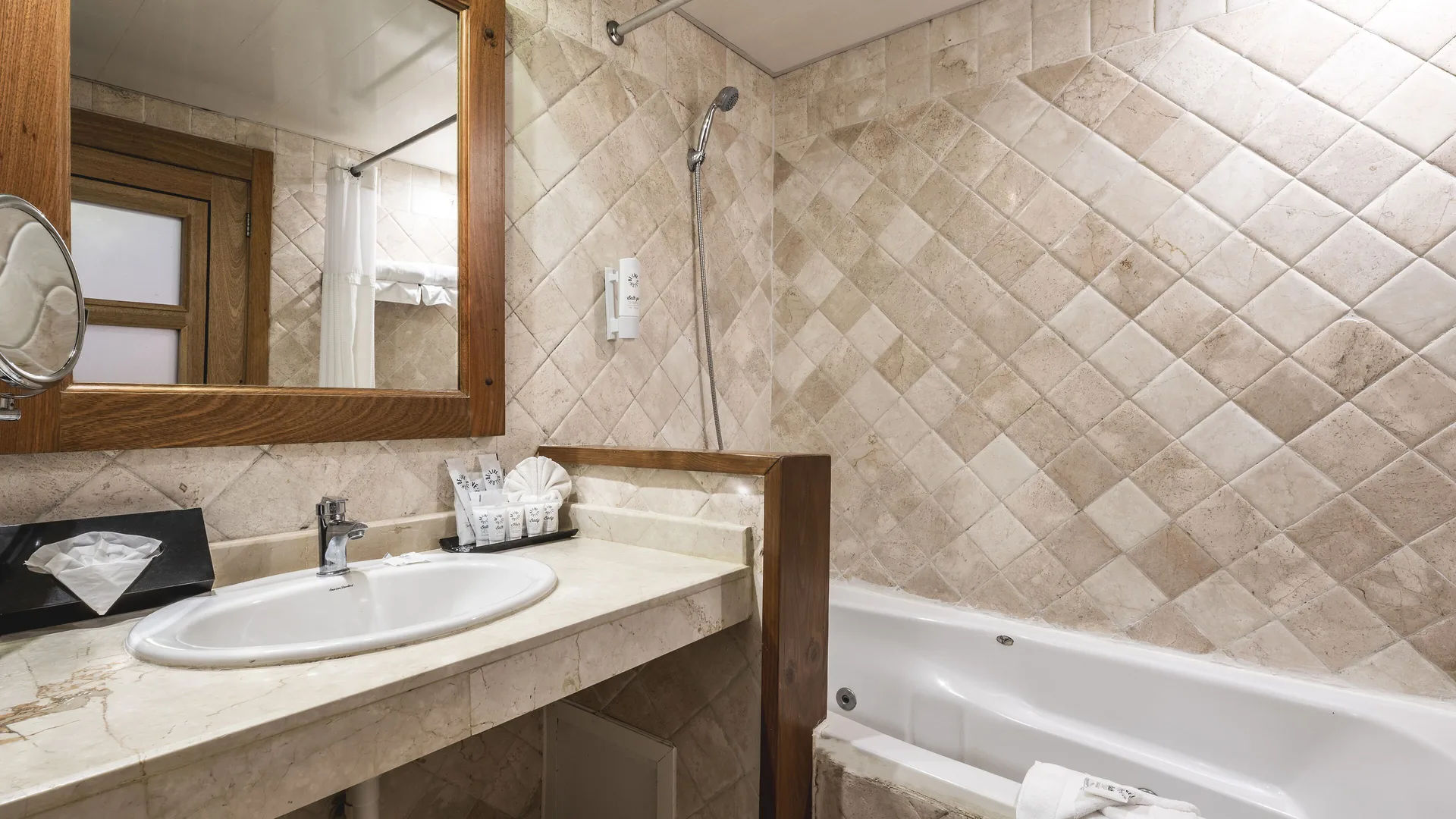 Superior Room Pool View bathroom vanity and bathtub at Marien Puerto Plata.