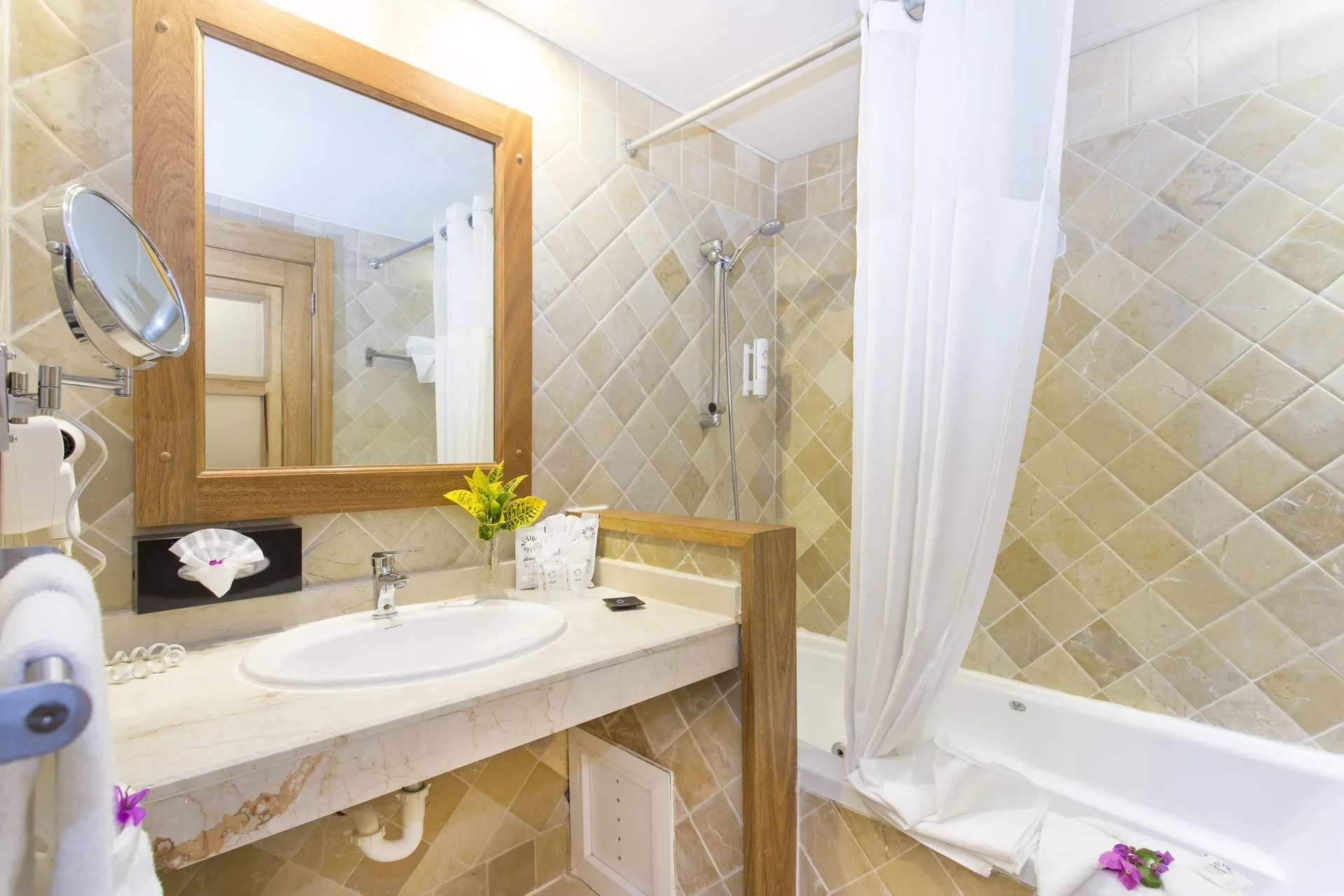 Superior Room Pool View bathroom with tub and vanity at Marien Puerto Plata.