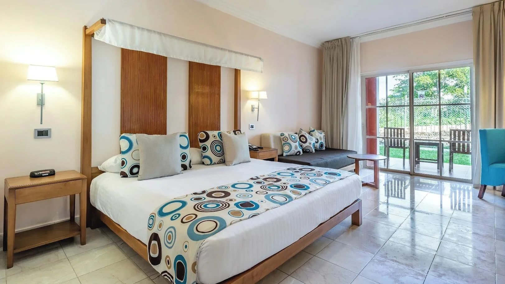 Superior Room Pool View king bed with terrace doors at Marien Puerto Plata.