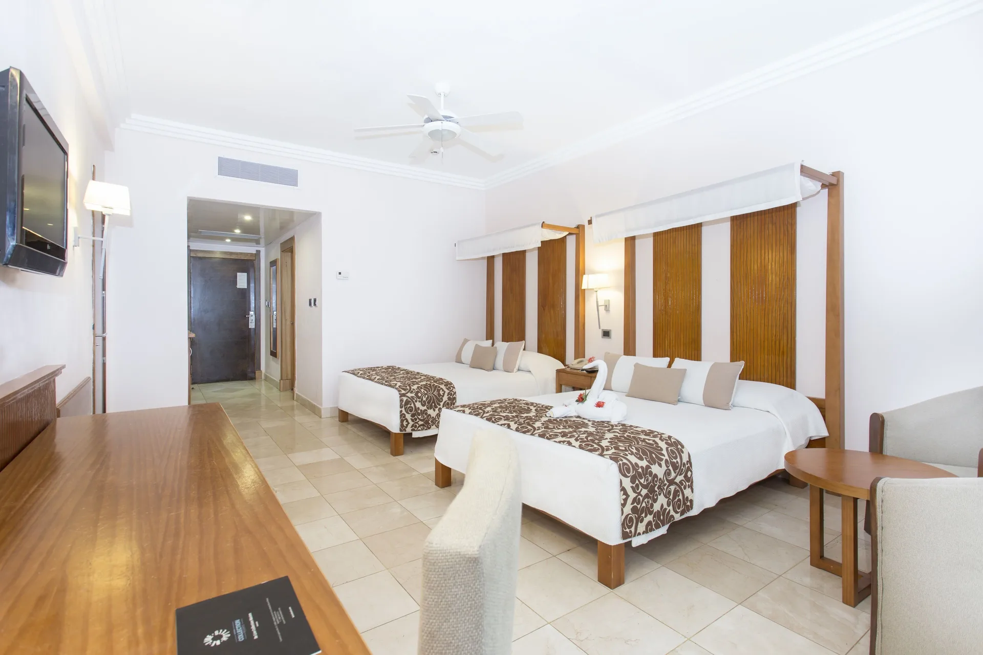 Superior Room Pool View with two double beds and TV at Marien Puerto Plata.