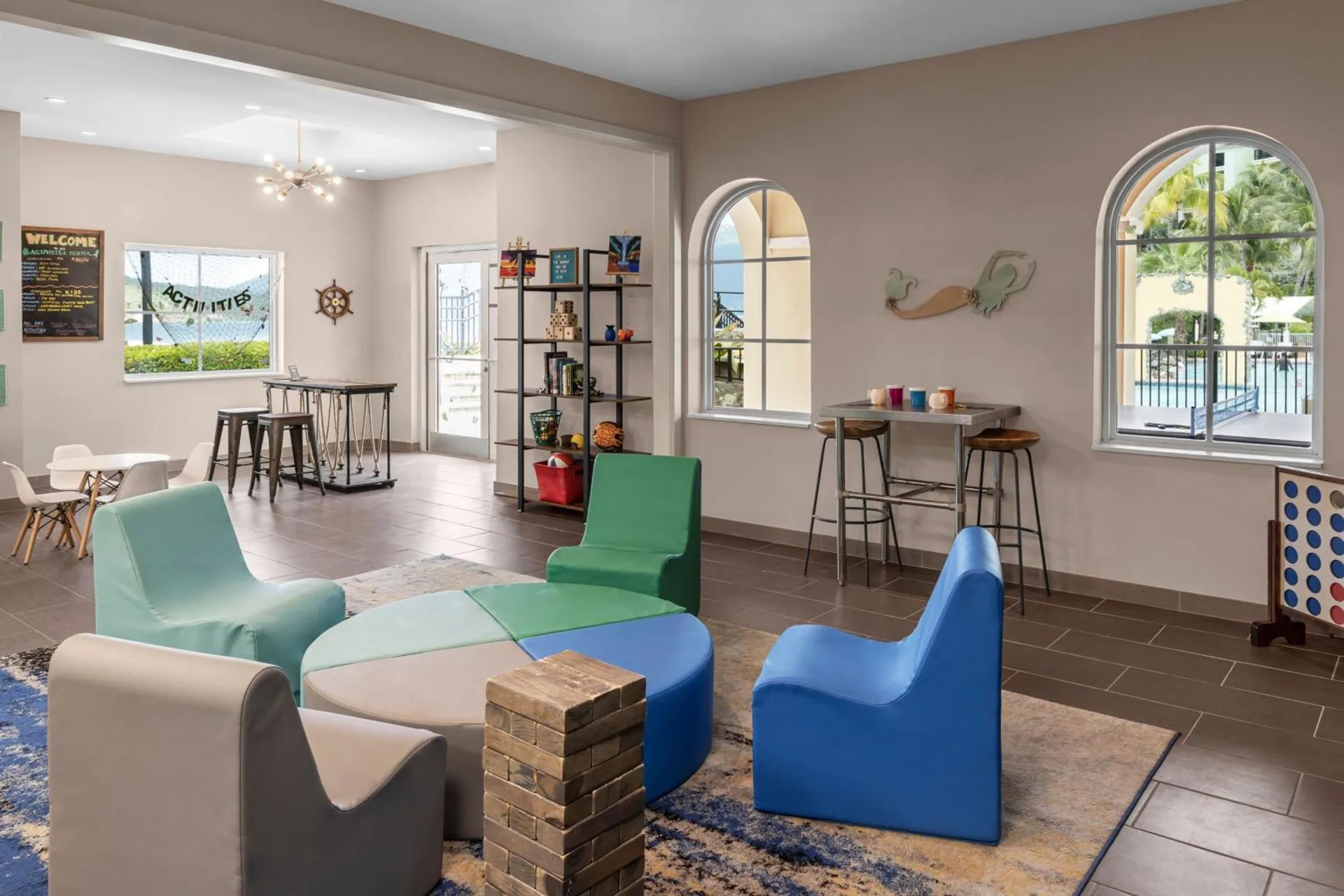 Colorful activity lounge seating and games at Marriott's Frenchman's Cove.