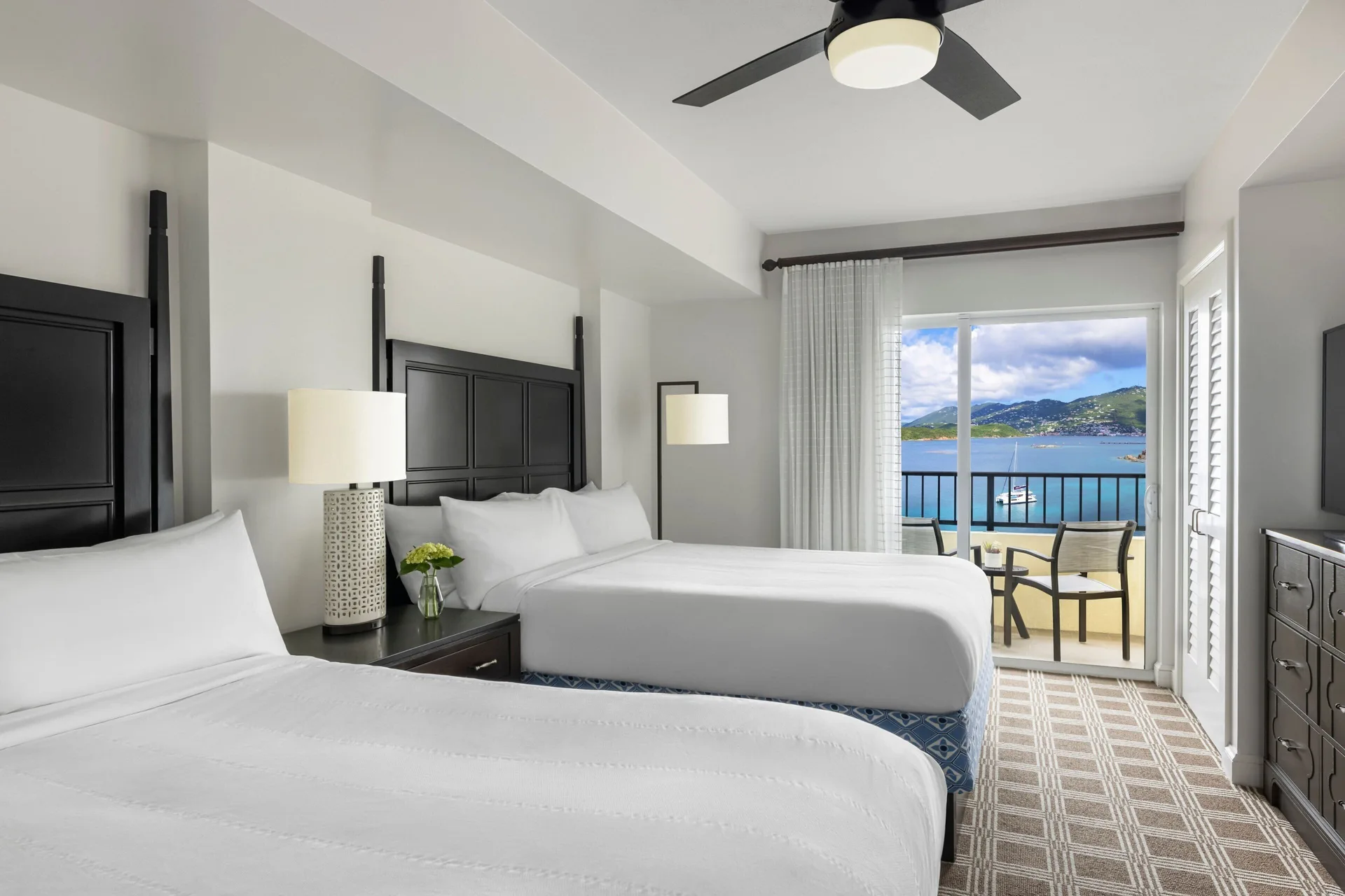 Bedroom with two beds and balcony water view at Marriott's Frenchman's Cove.