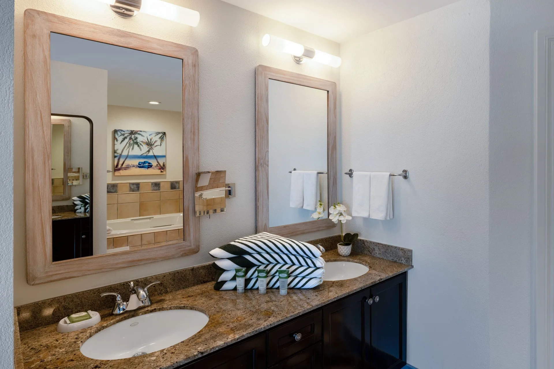 Double vanity bathroom in a three-bedroom villa at Marriott's St. Kitts Beach Club with mirrors and towels.