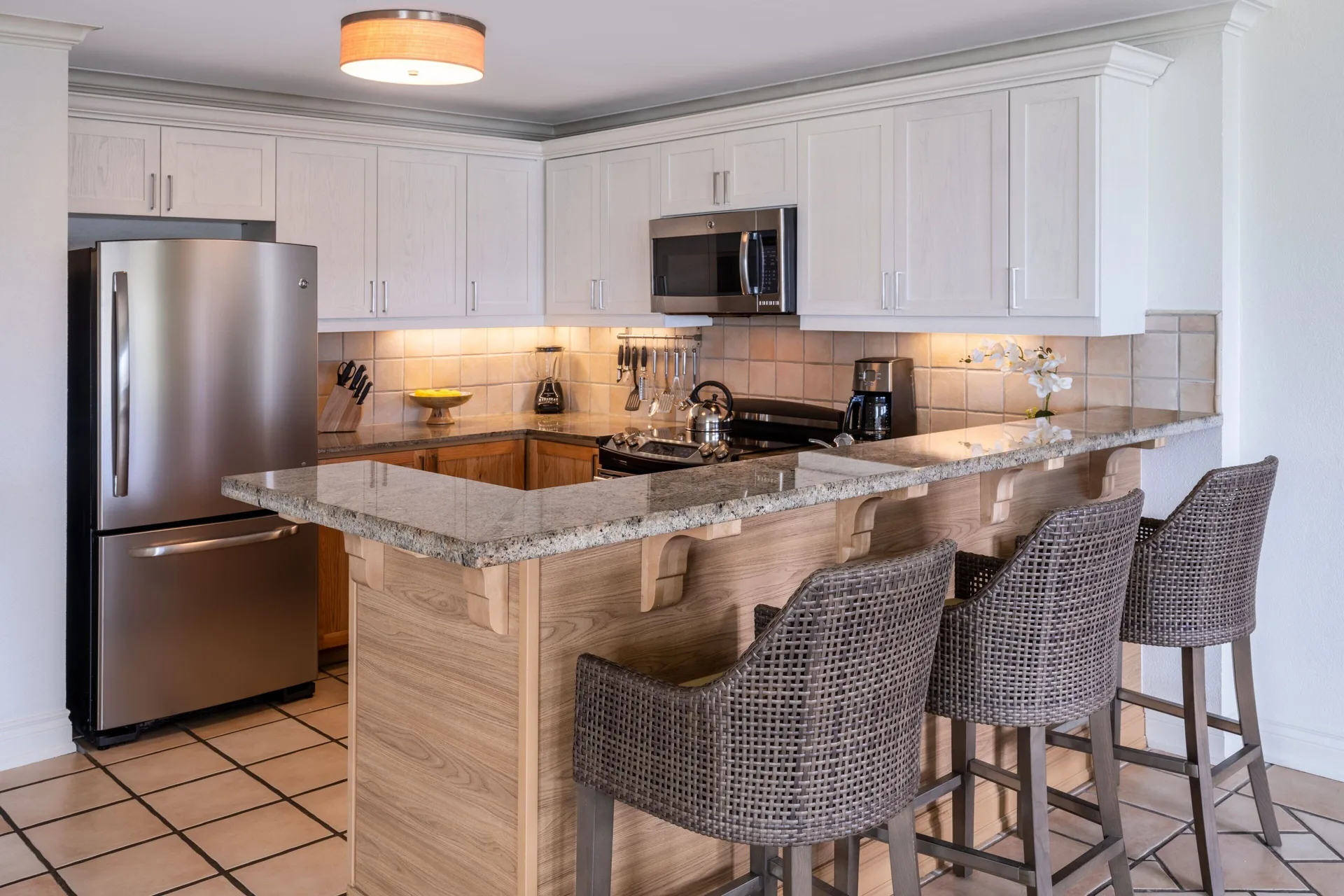 Kitchen in a three-bedroom villa at Marriott's St. Kitts Beach Club with breakfast bar seating.