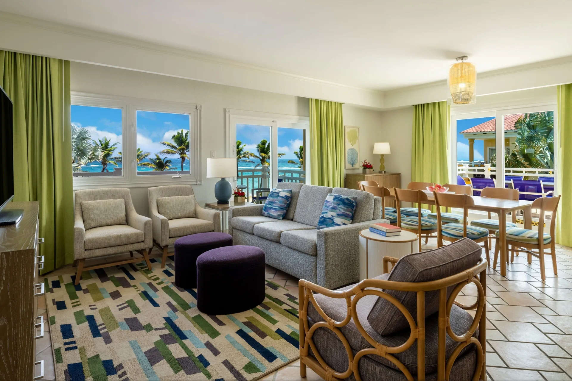 Living and dining area in a three-bedroom villa at Marriott's St. Kitts Beach Club with ocean views.