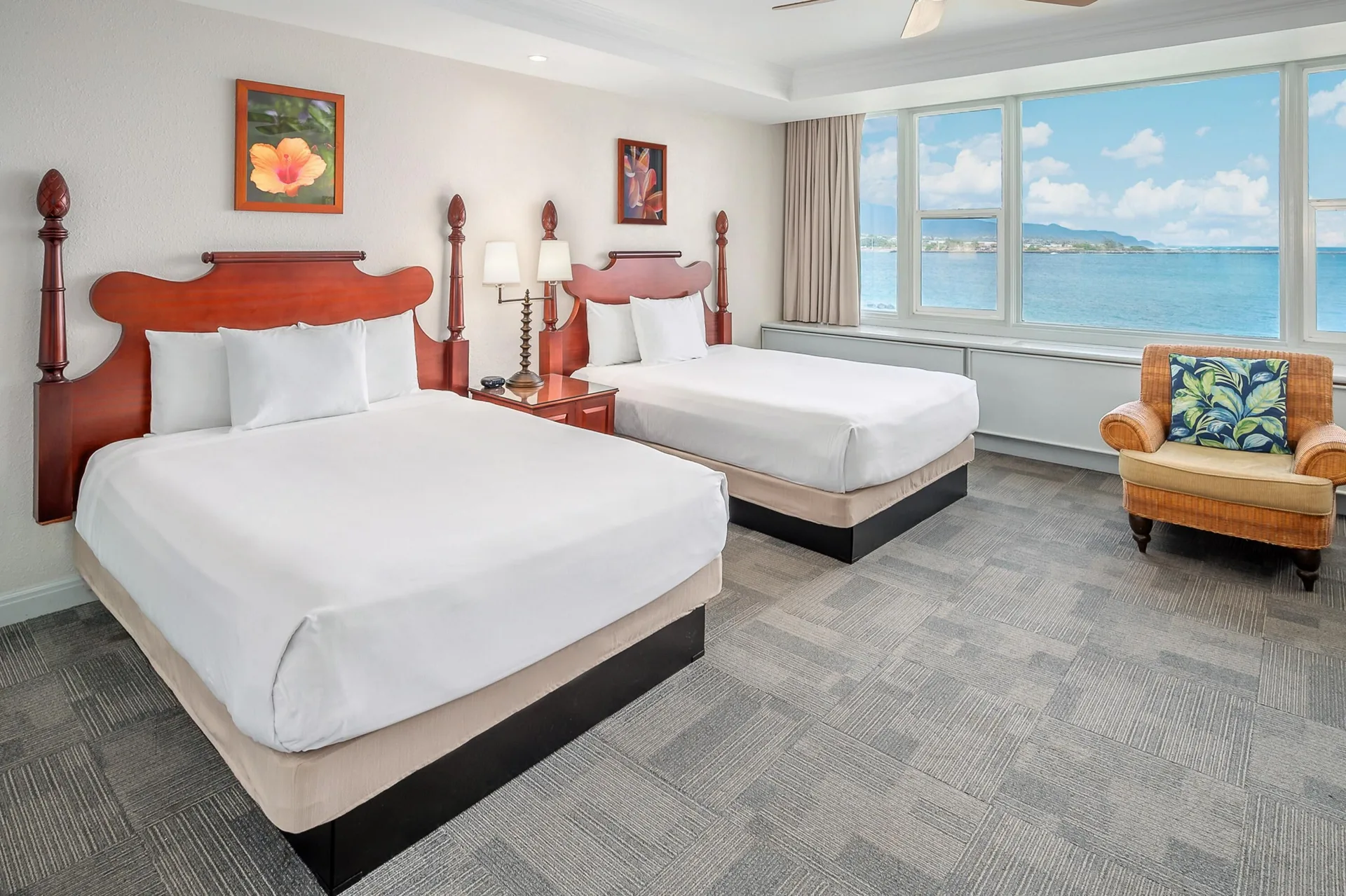 Oceanfront suite two-bed room with bay view windows at Maui Beach Hotel.