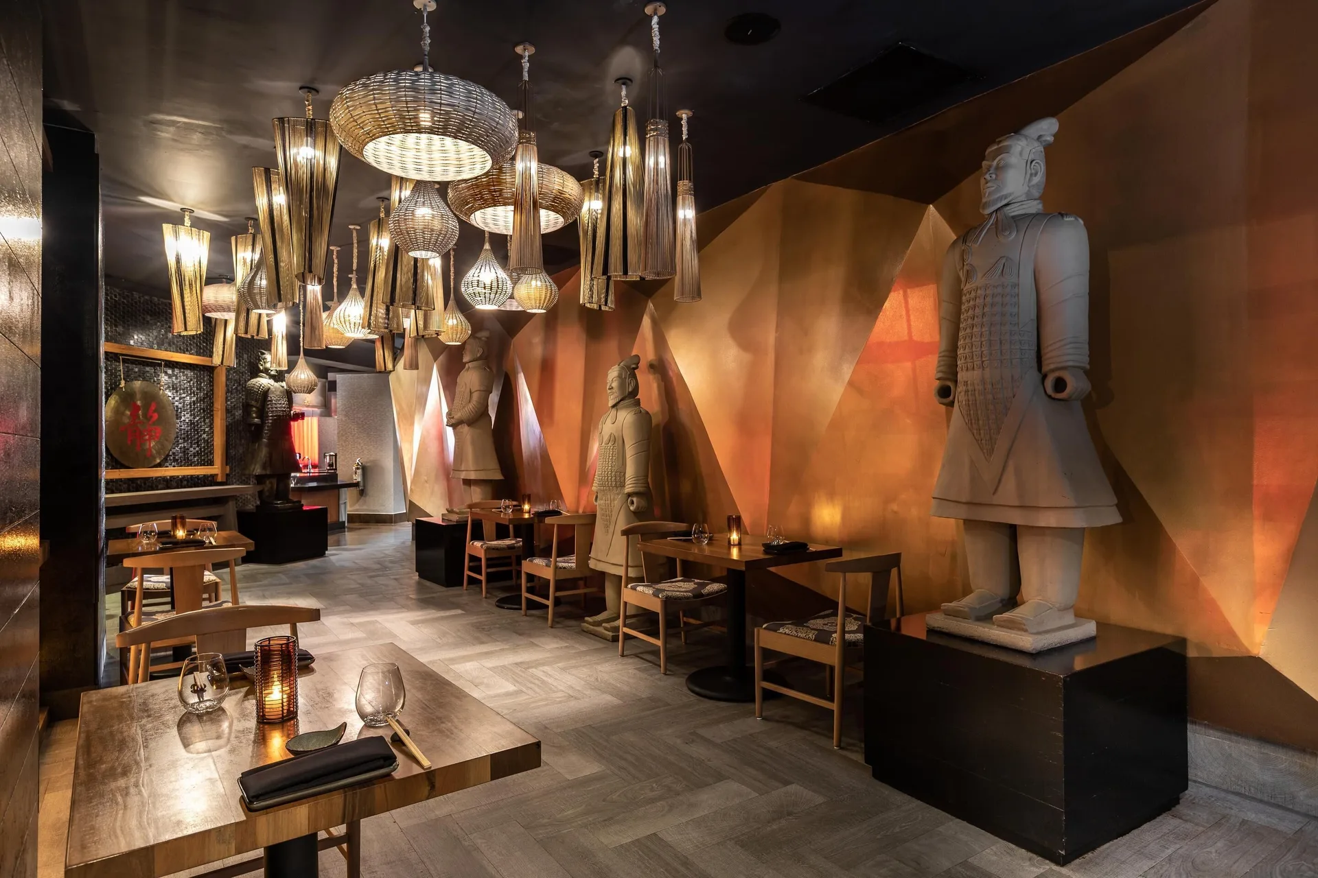 Warm dining room with terracotta statues and pendant lights at Moon Palace Jamaica.