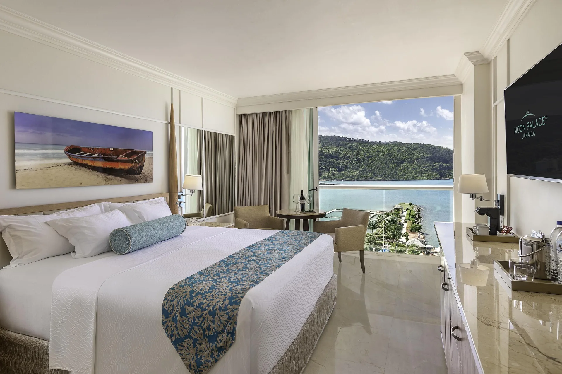 Deluxe Ocean View king room with balcony view at Moon Palace Jamaica.