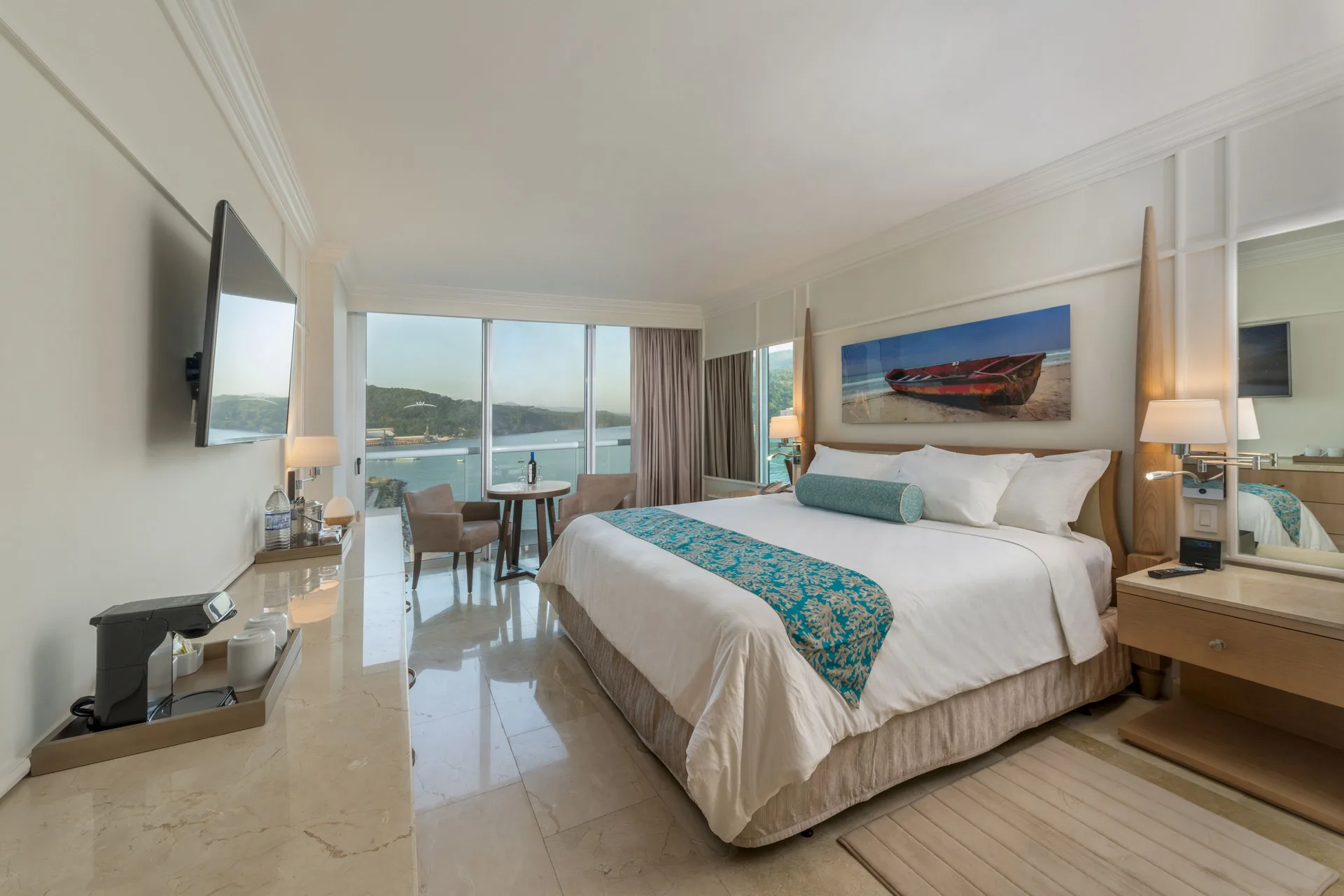 Deluxe Ocean View king room with TV and seating area at Moon Palace Jamaica.