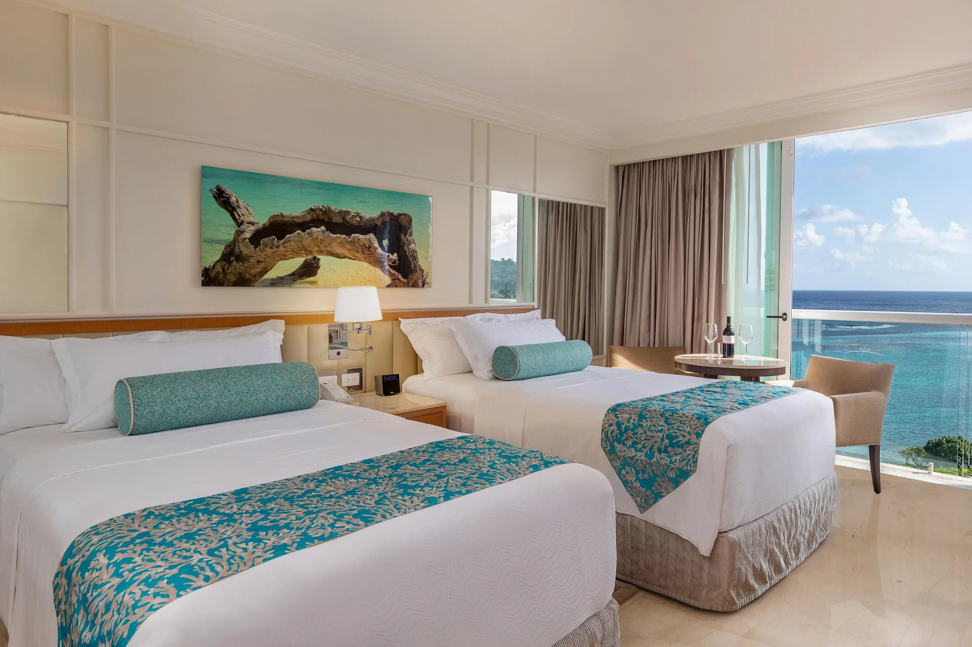 Deluxe Ocean View double-bed room overlooking the sea at Moon Palace Jamaica.