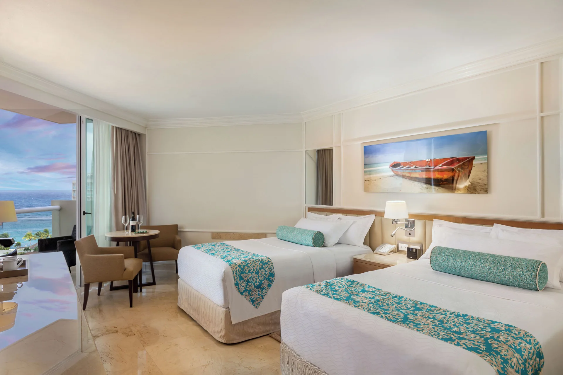Deluxe Resort View room with two beds and ocean-facing balcony at Moon Palace Jamaica.