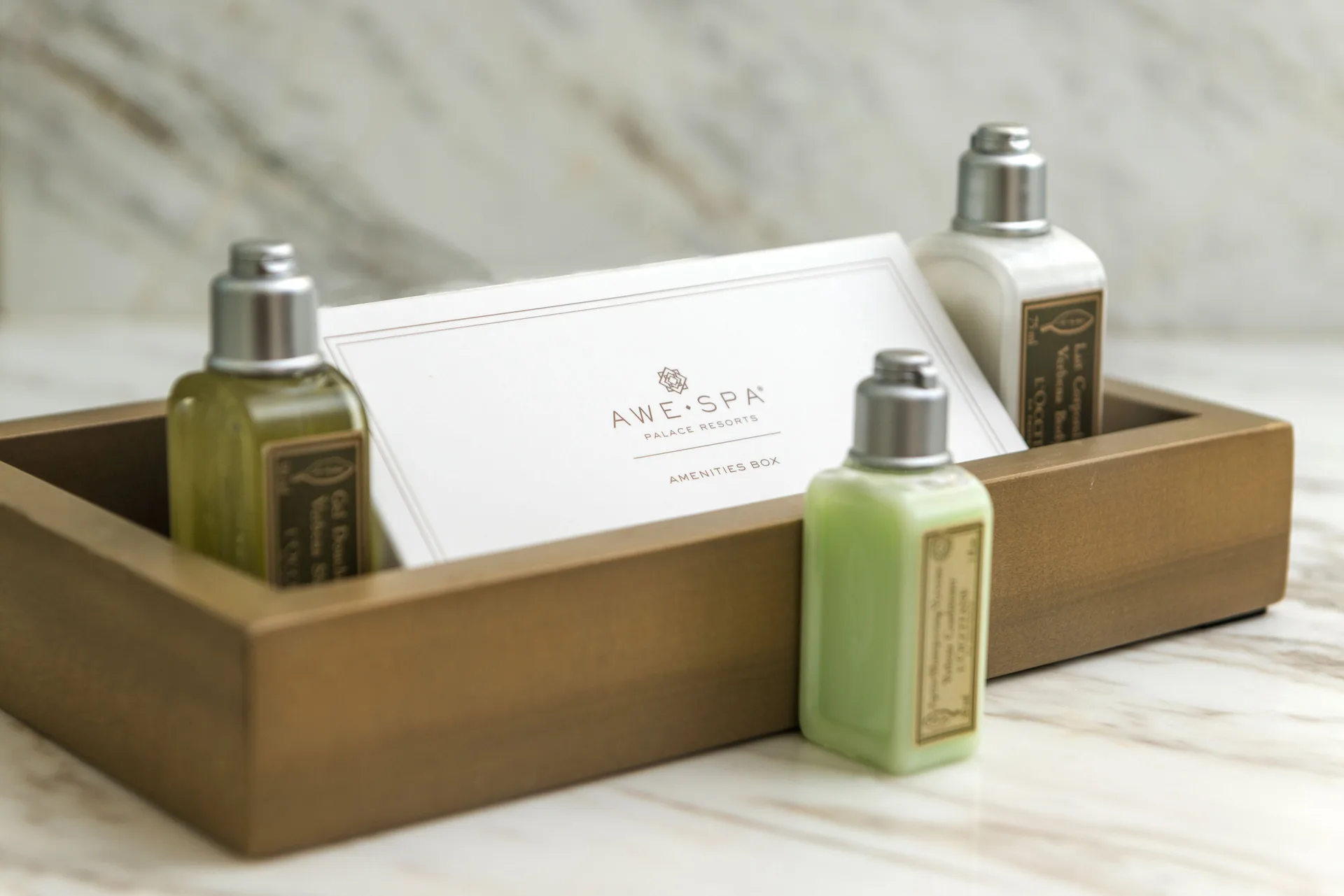 Amenity bottles in a tray inside a Superior Honeymoon Suite at Moon Palace Jamaica.