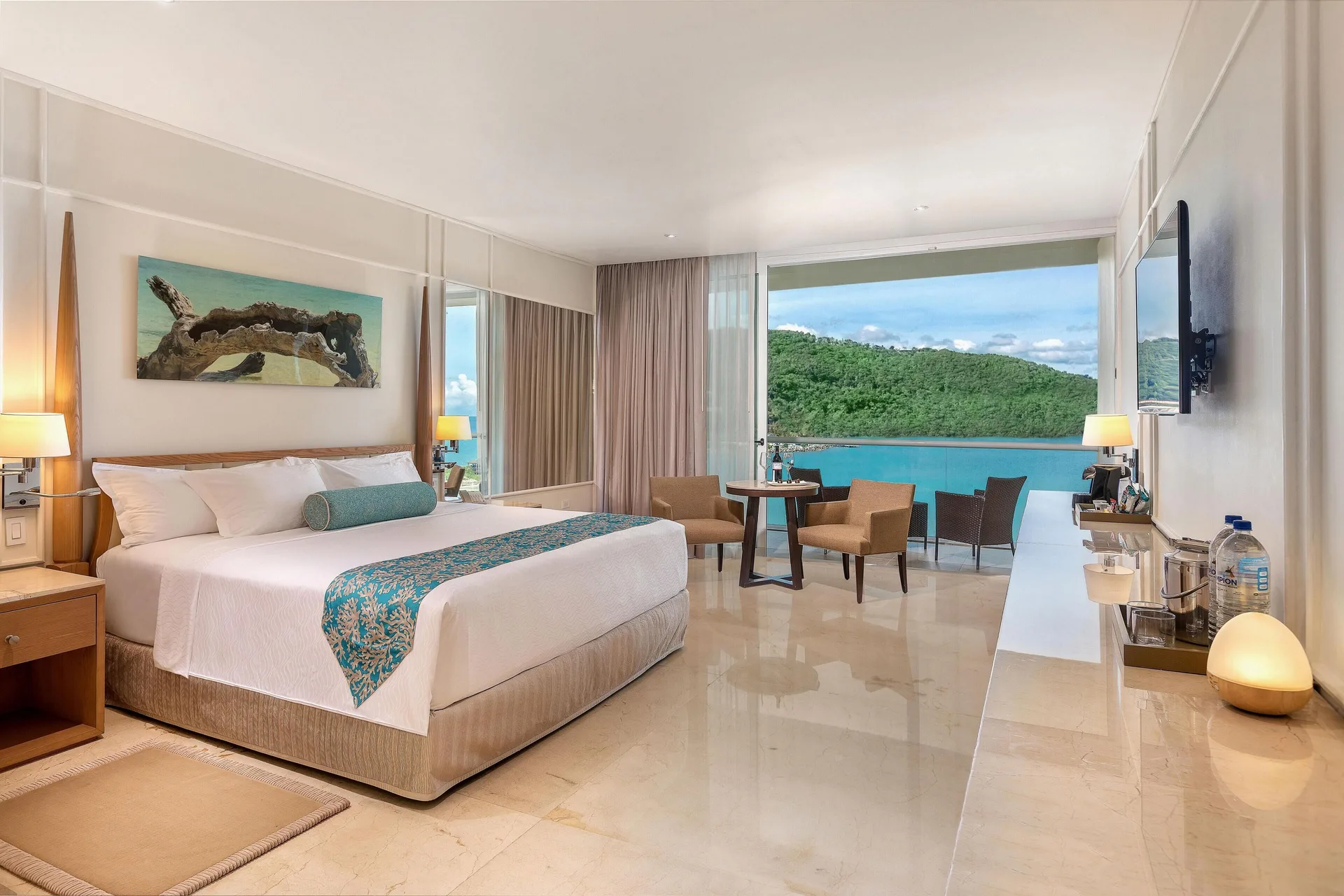 Superior Junior Suite Ocean View king bed and balcony at Moon Palace Jamaica.